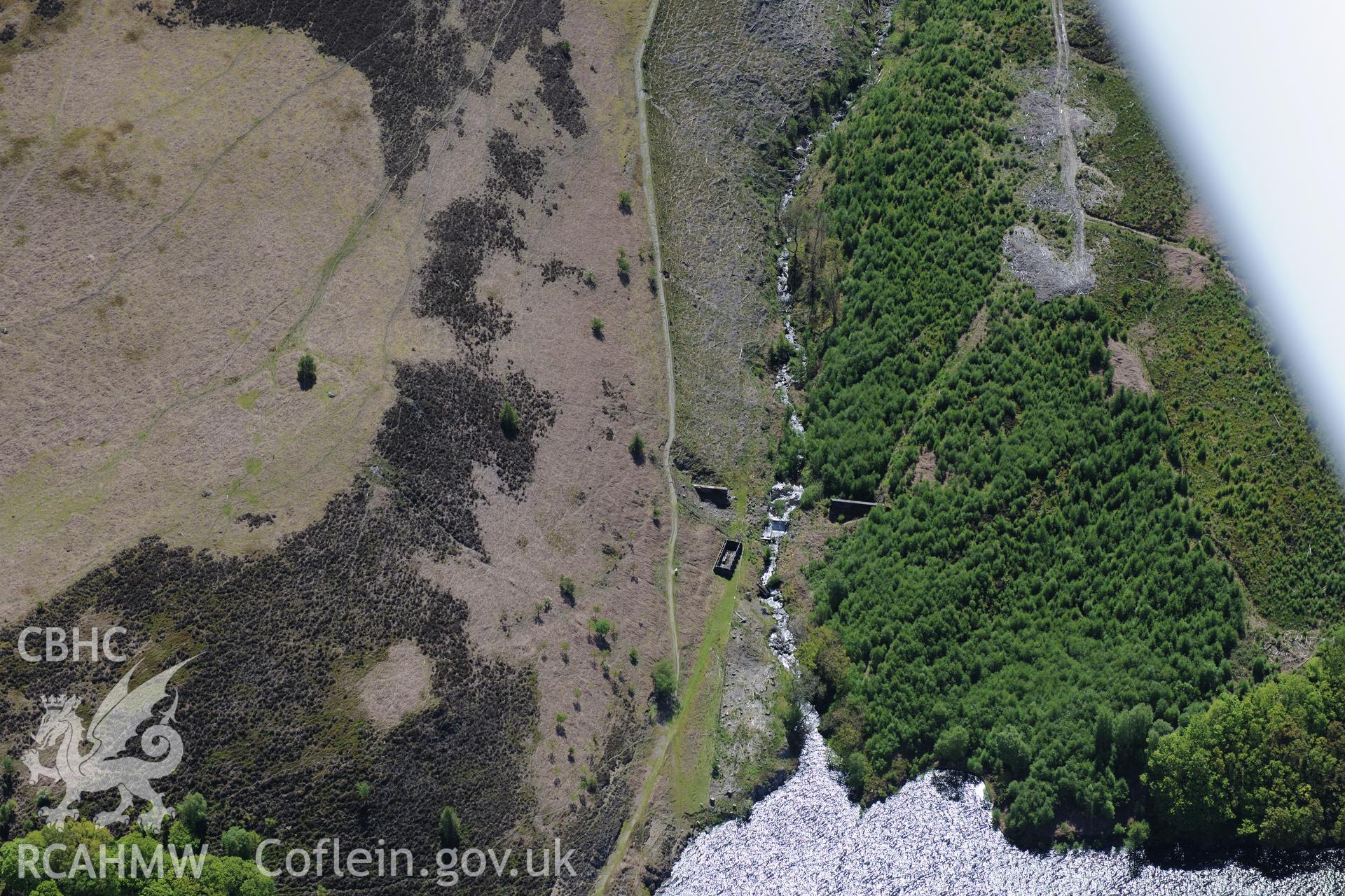 Nant-y-Gro Dam -'Dambusters' testing dam at Elan Valley water scheme. Oblique aerial photograph taken during the Royal Commission's programme of archaeological aerial reconnaissance by Toby Driver on 3rd June 2015.