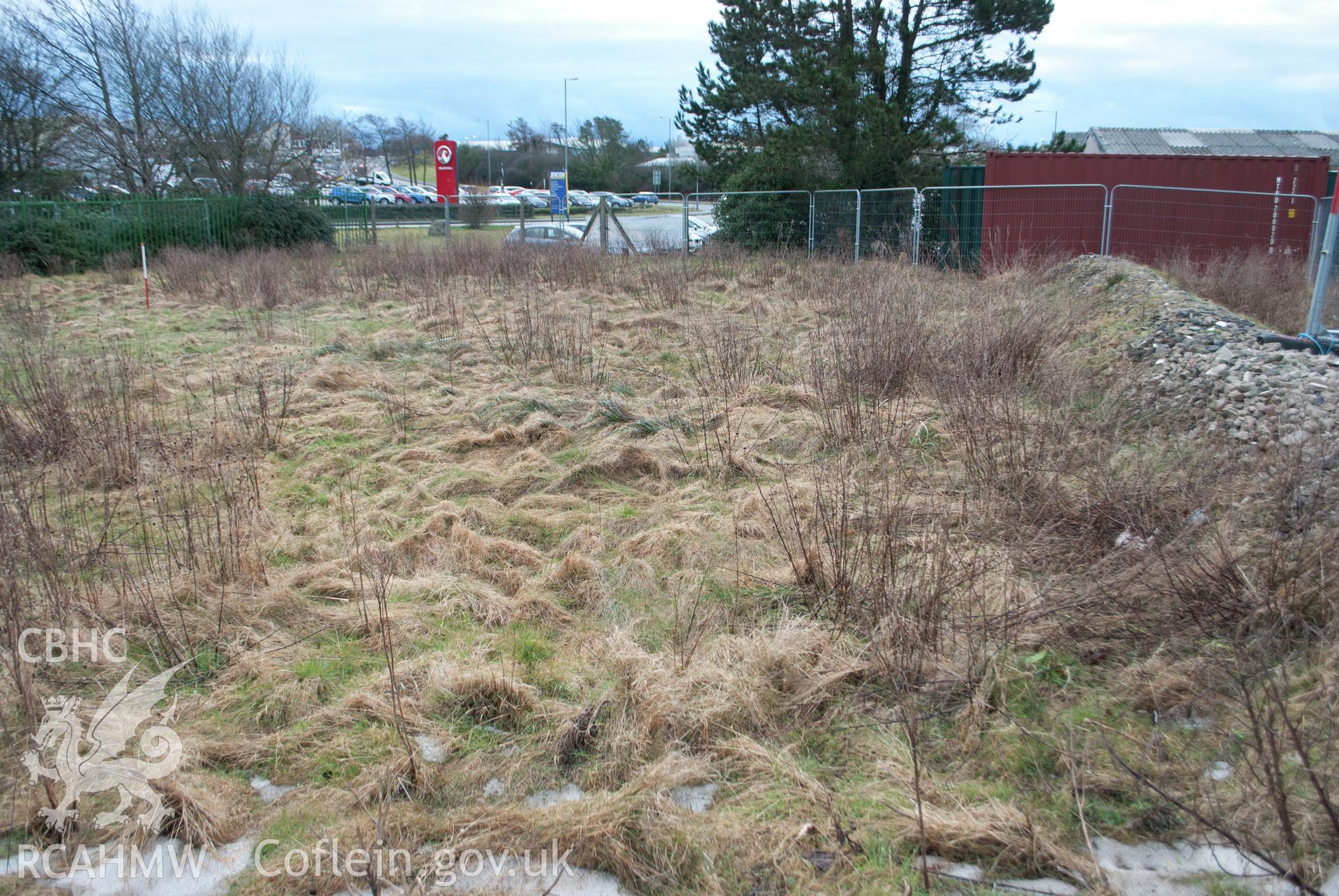 General view from the north west of the western area of the site, pre-excavation. Photographed by Gwynedd Archaeological Trust during archaeological watching brief at Pen-yr-Orsedd, Llangefni industrial estate, on 7th March 2018.