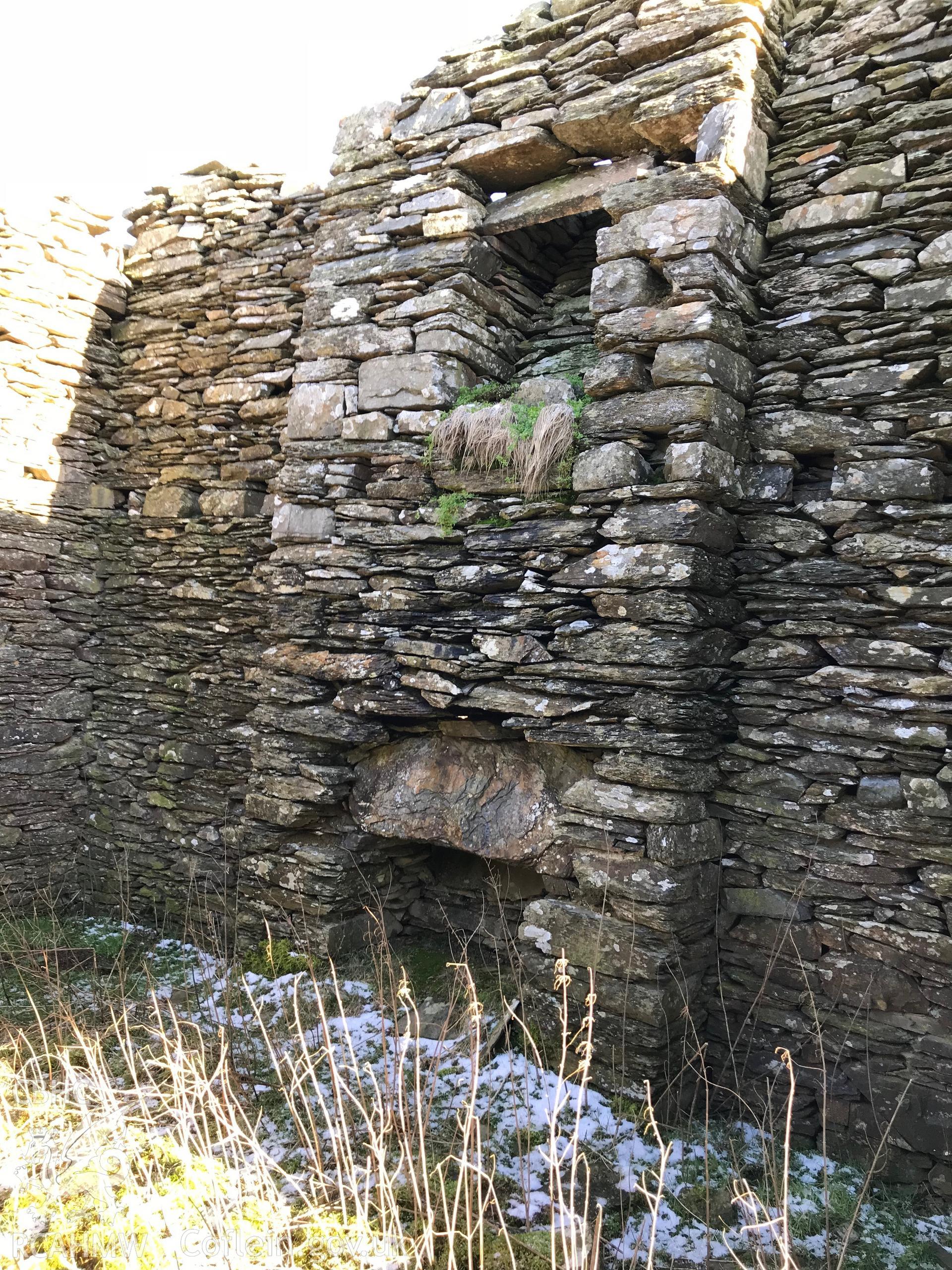 Detailed interior view showing remains of fireplace and chimney at Ty-Canol house, Creigen Ddu. Colour photograph taken by Paul R. Davis on 17th January 2019.