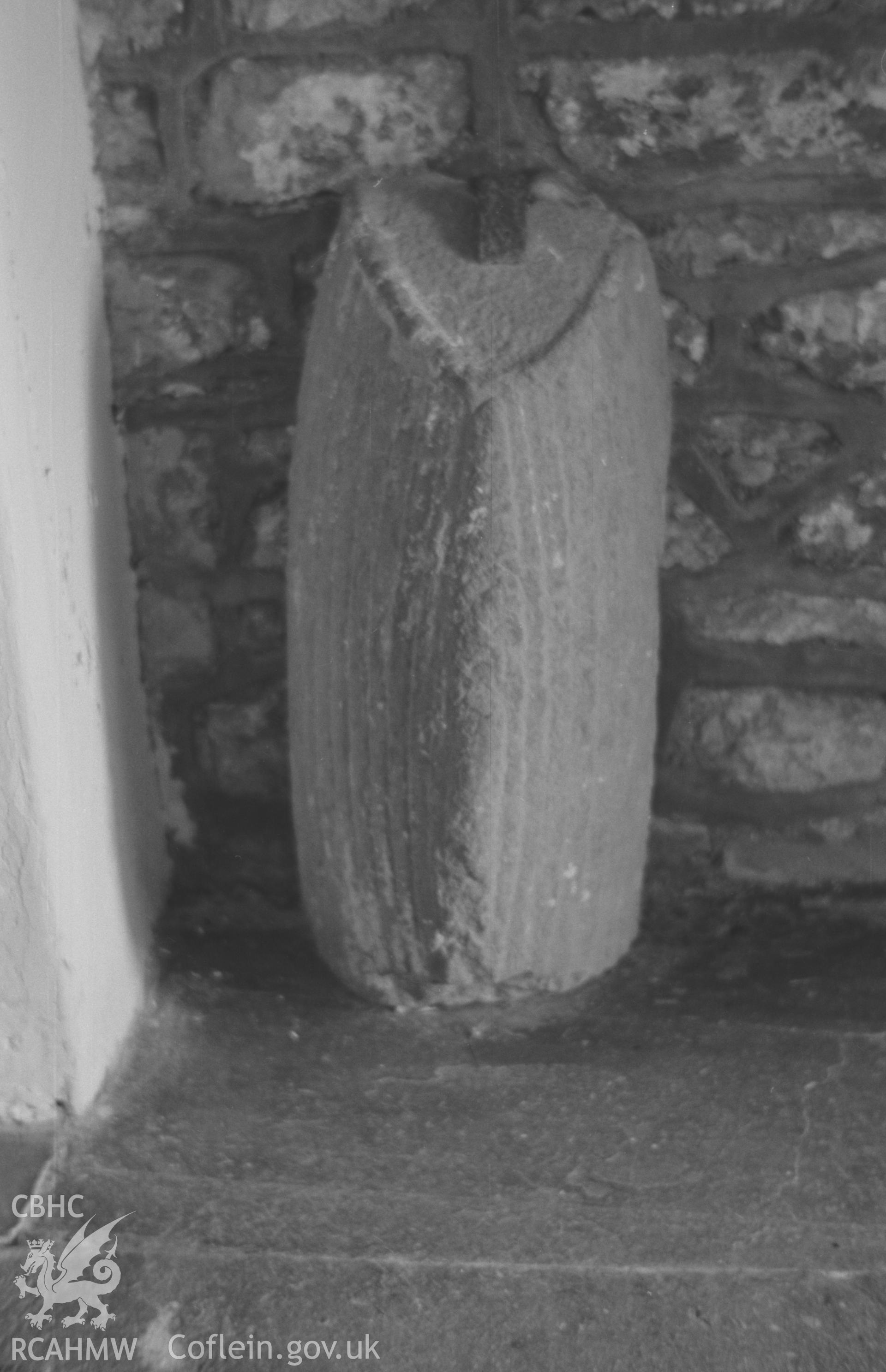 Digital copy of a black and white negative showing end portion of a recumbent hogbacked stone inside porch under tower of St. David's Church, Llanddewi Aberarth. Photographed by Arthur O. Chater on 5th September 1966 from Grid Reference SN 4766 6329.