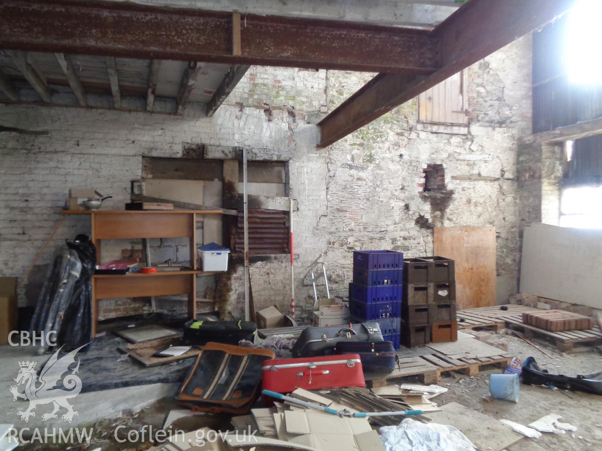 Brick and rubble masonry wall. South west elevation. Photographed as part of archaeological building survey of The Old Sawmill, Llanidloes, Powys, conducted by Archaeology Wales, 2018. Project no. 2583. Report no. 1645.