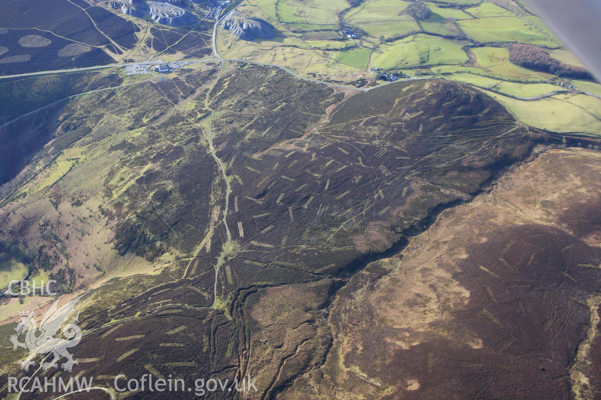 RCAHMW colour oblique photograph of Moel-y-Faen quarries, Horseshoe Pass, from the east. Taken by Toby Driver on 08/02/2011.
