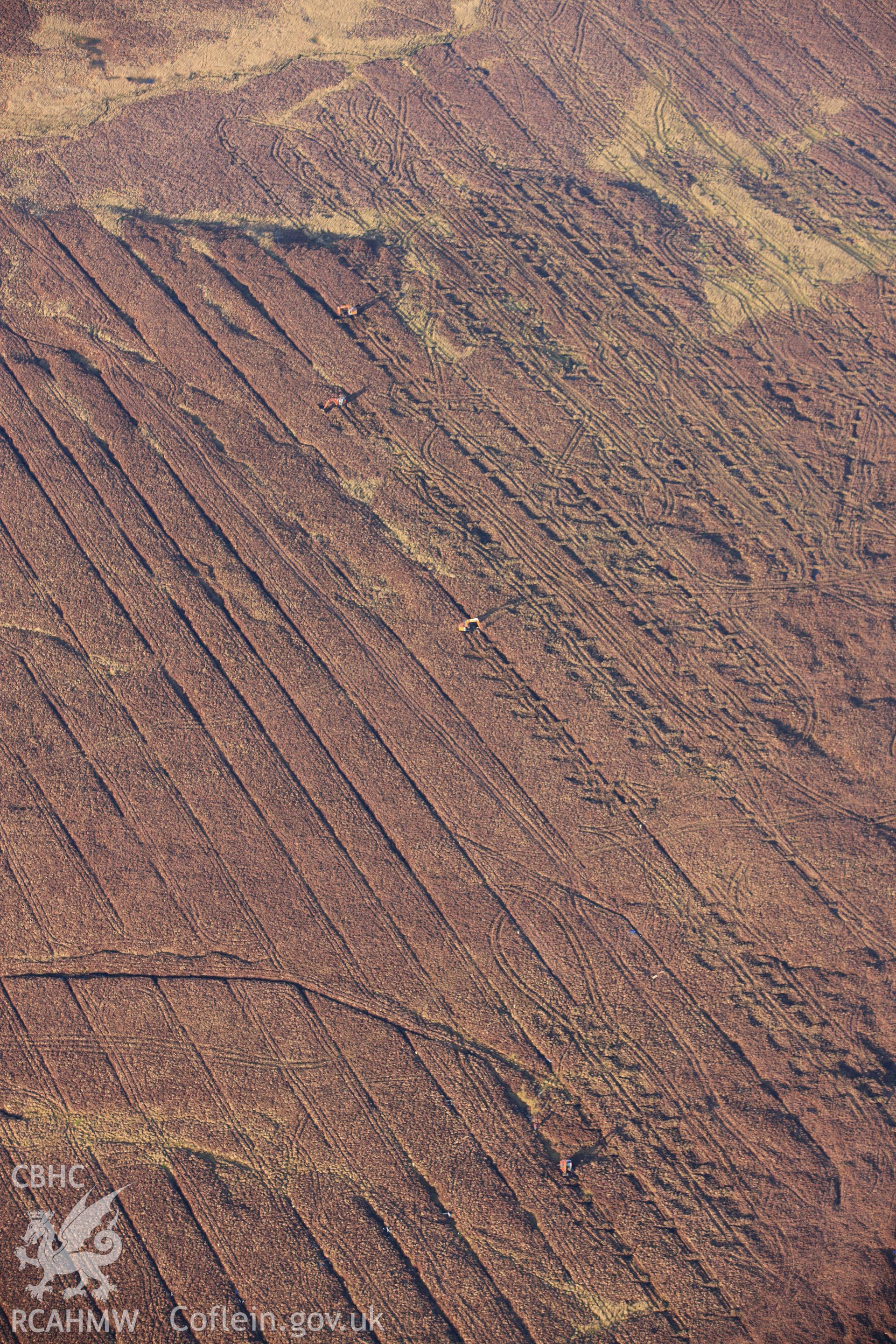 RCAHMW colour oblique photograph of landscape south of Fynnon Eidda, with drain filling in progress. Taken by Toby Driver on 08/02/2011.