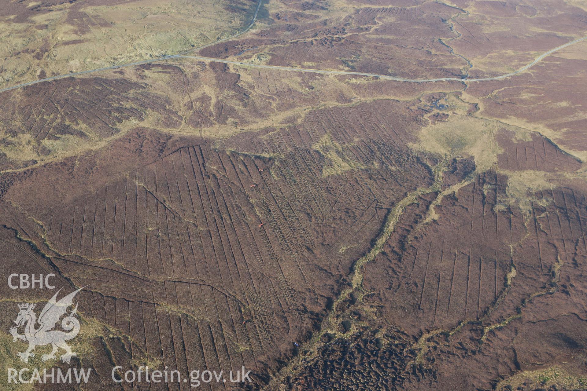RCAHMW colour oblique photograph of landscape south of Fynnon Eidda, with drain filling in progress. Taken by Toby Driver on 08/02/2011.