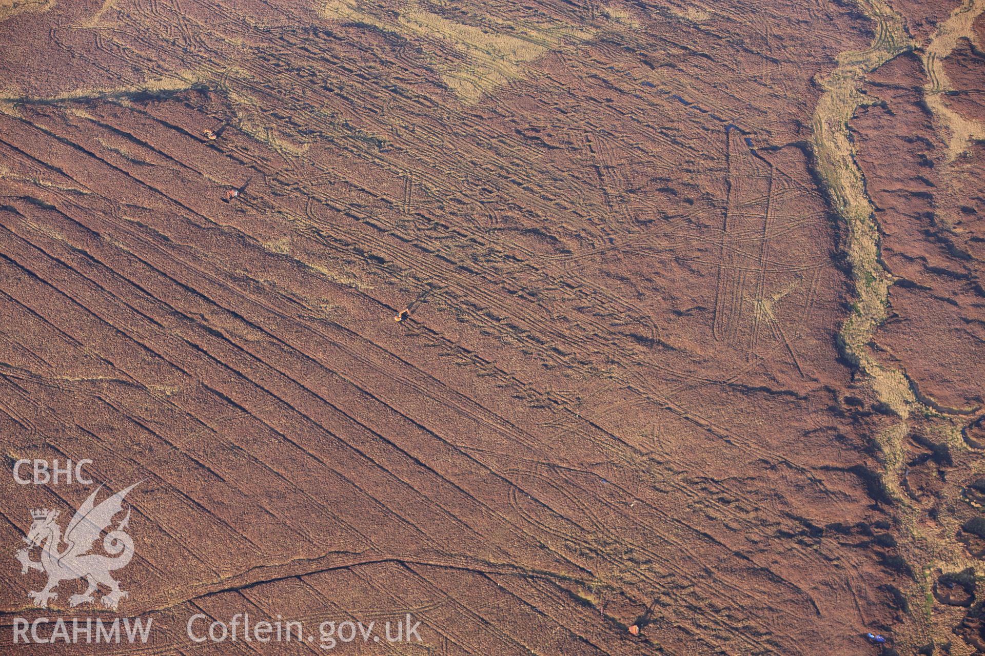 RCAHMW colour oblique photograph of landscape south of Fynnon Eidda, with drain filling in progress. Taken by Toby Driver on 08/02/2011.