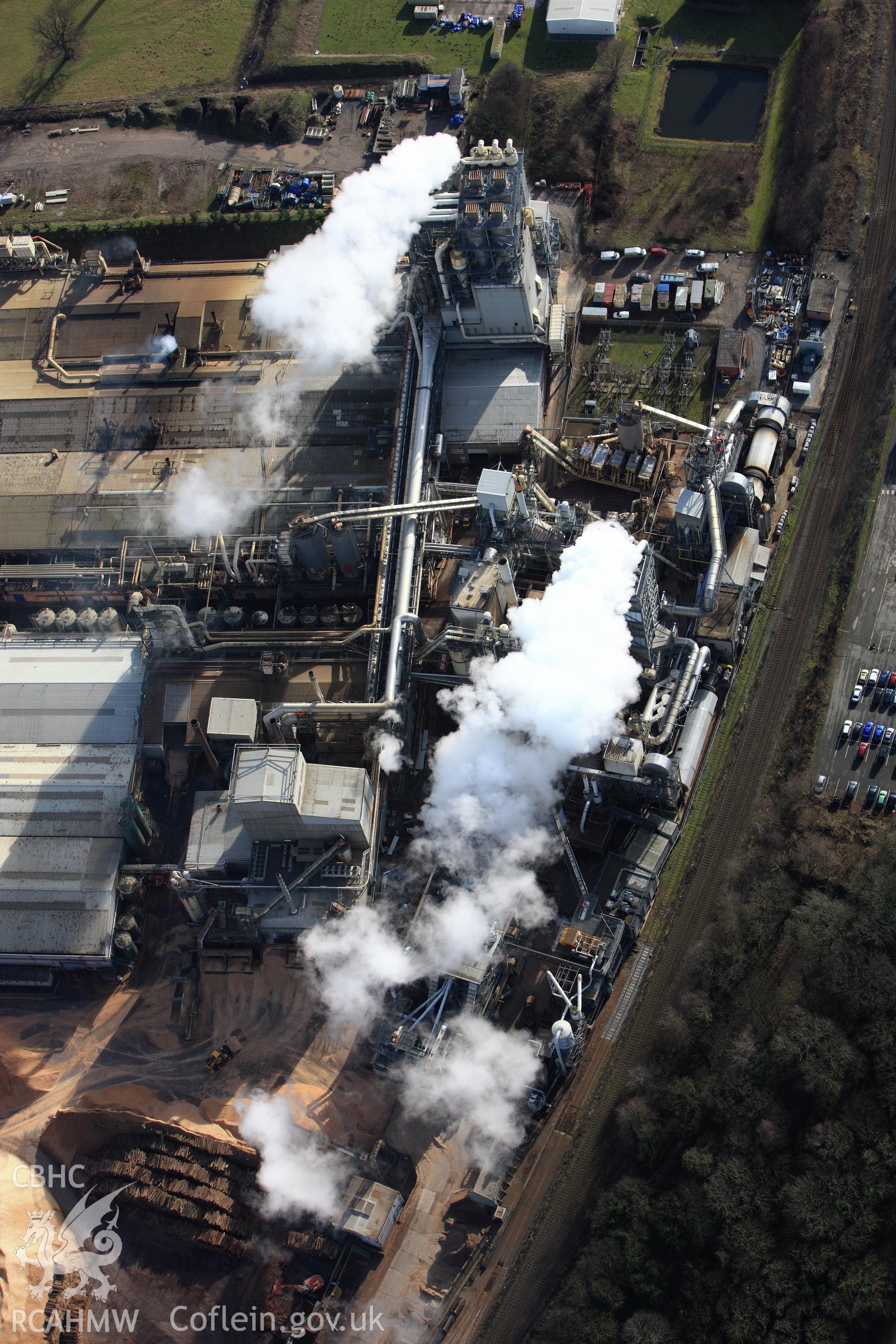 RCAHMW colour oblique photograph of Chronospan Woodchip factory, Chirk. Taken by Toby Driver on 08/02/2011.