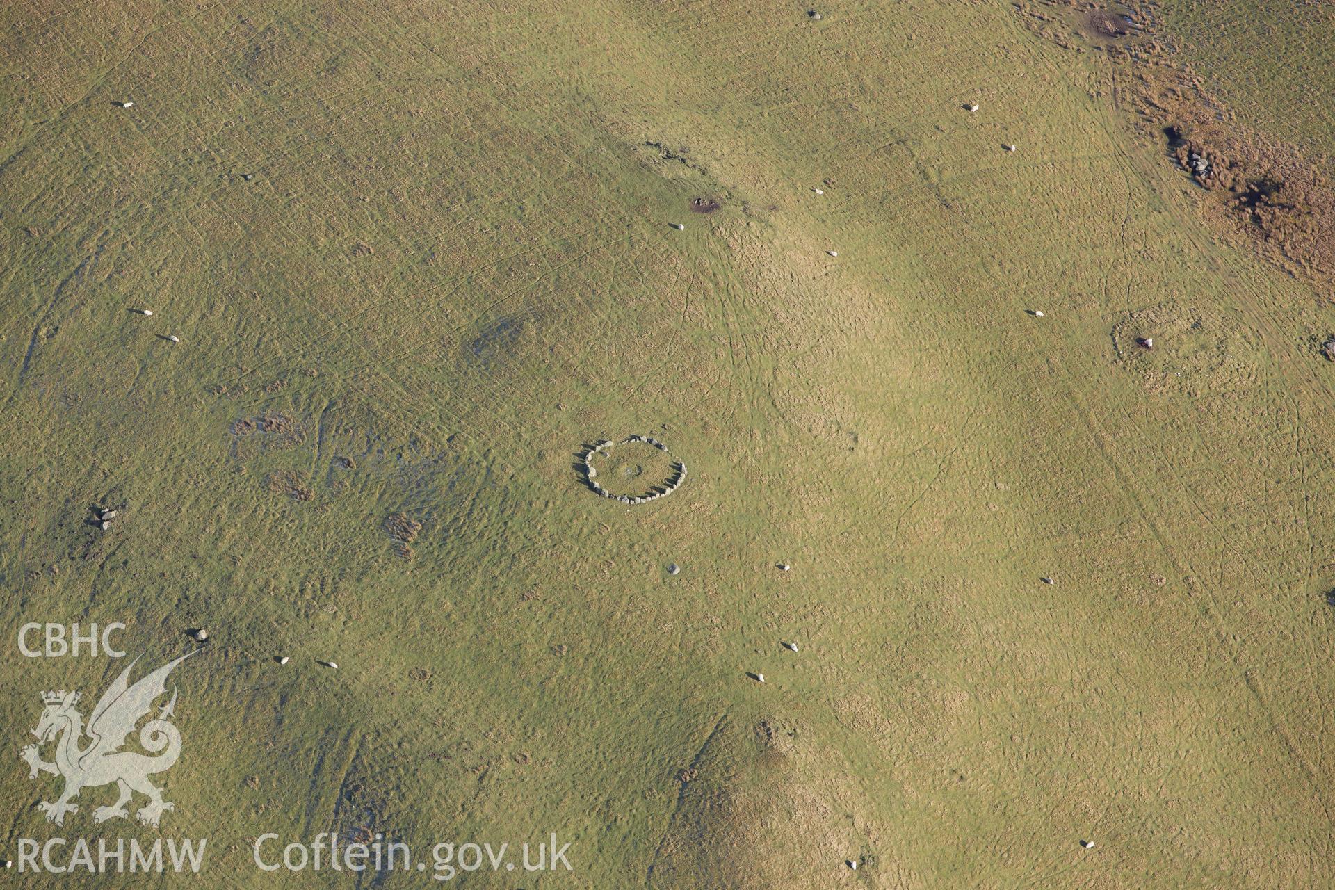RCAHMW colour oblique photograph of Moel Ty-Uchaf ring cairn. Taken by Toby Driver on 08/02/2011.