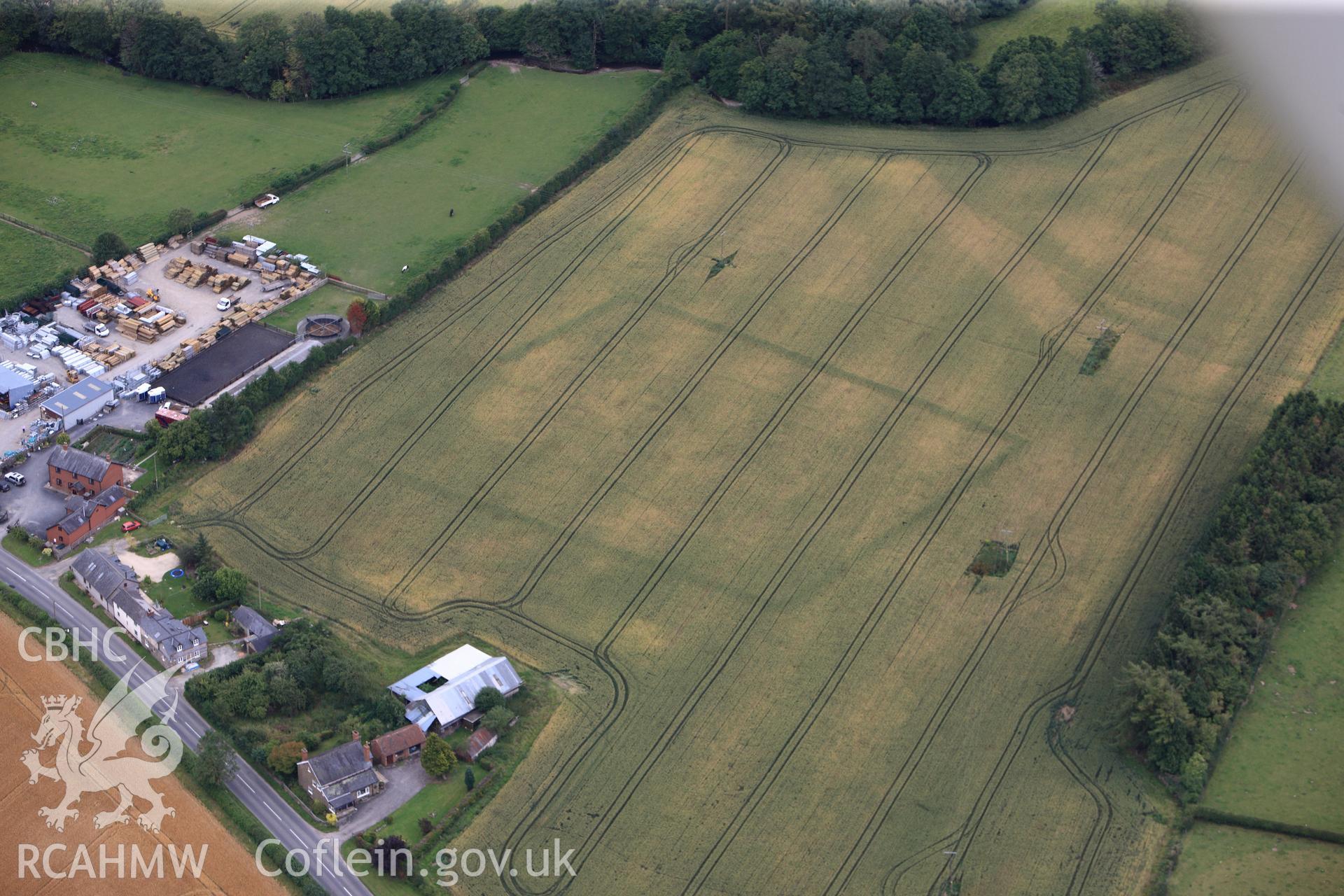 RCAHMW colour oblique photograph of Broadheath Roman villa, cropmark of main enclosure. Taken by Toby Driver on 20/07/2011.