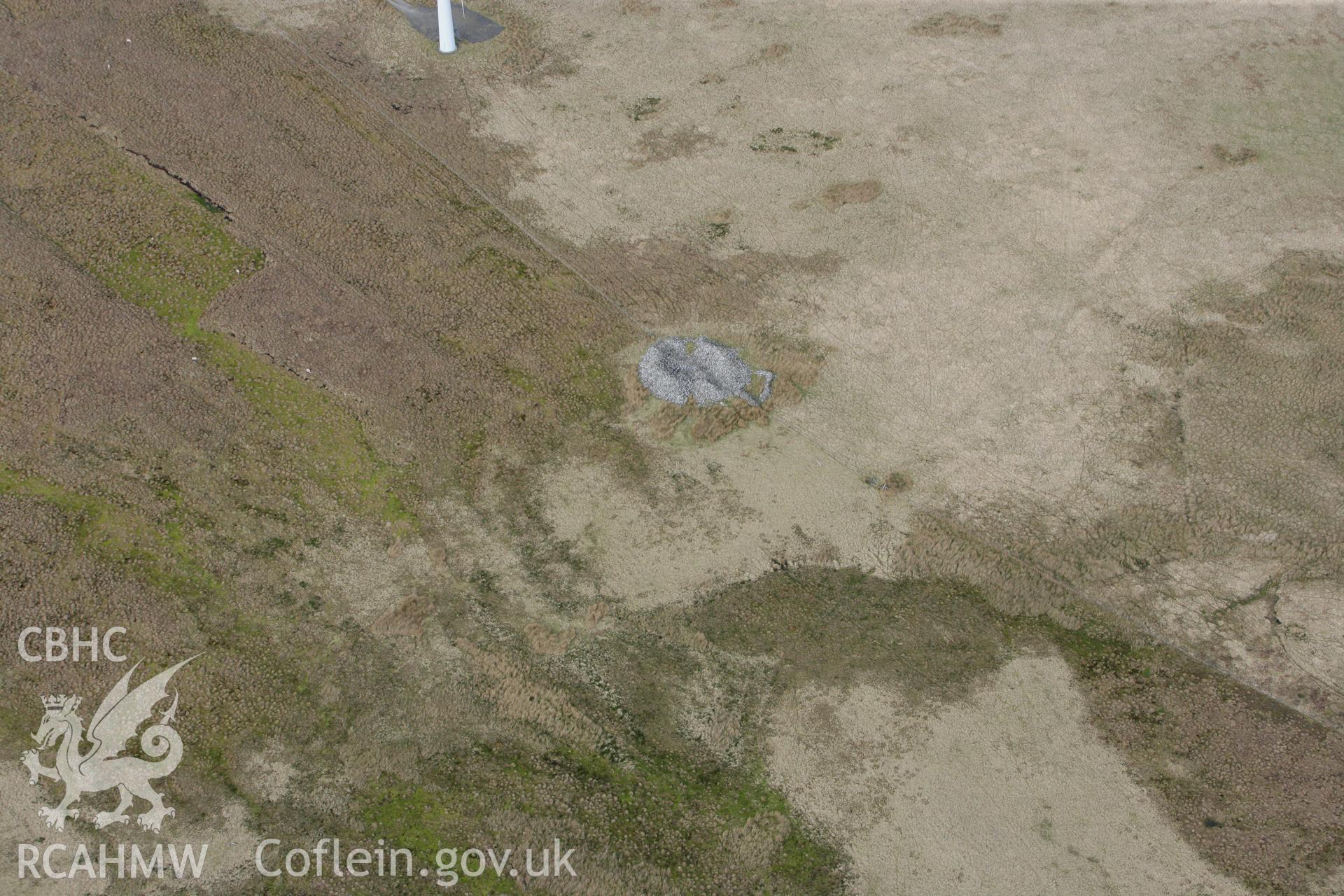 RCAHMW colour oblique photograph of 	Twr-Gwyn Mawr Cairn. Taken by Toby Driver on 22/03/2011.