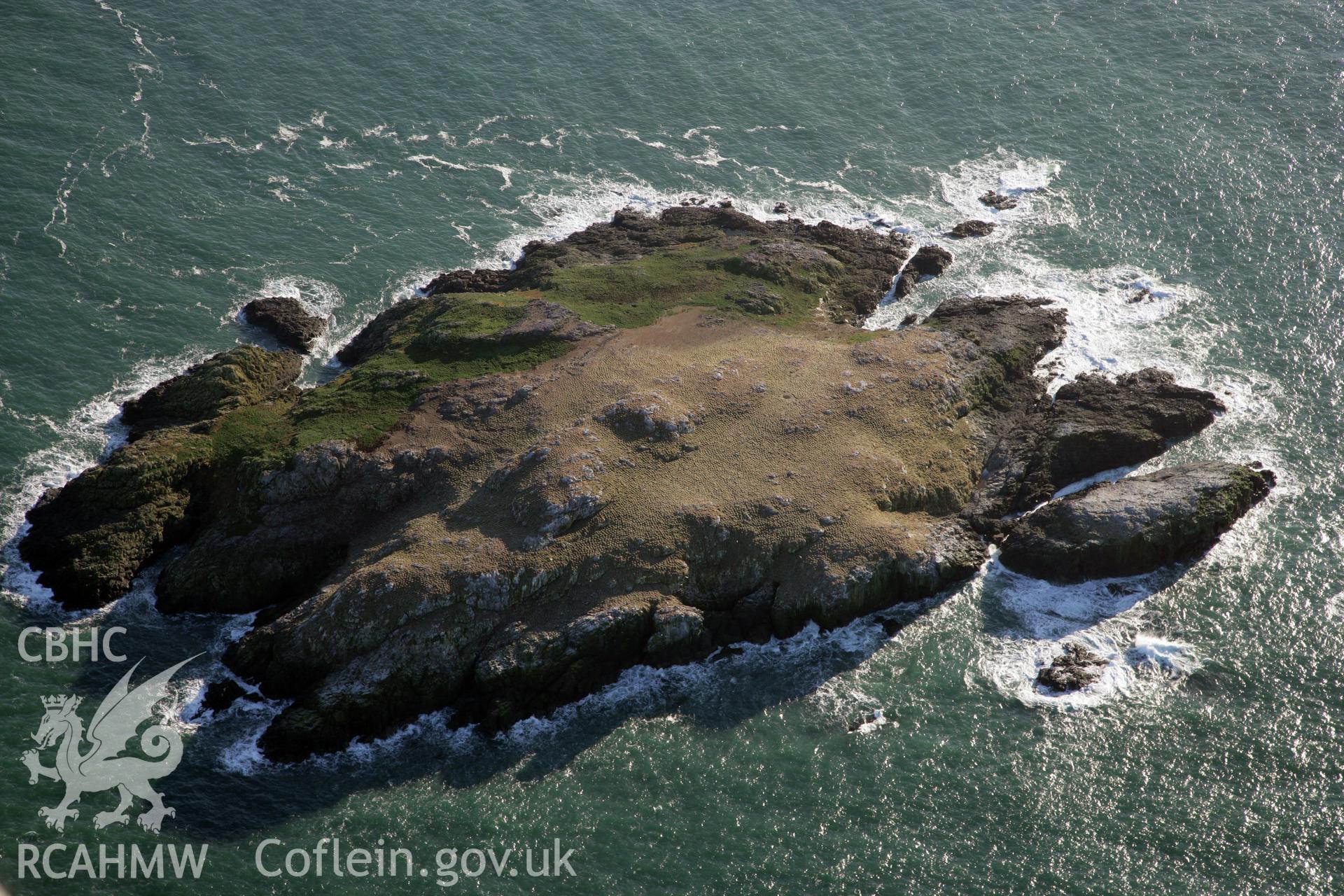 RCAHMW colour oblique photograph of Grassholm Island, viewed from the north. Taken by O. Davies & T. Driver on 22/11/2013.