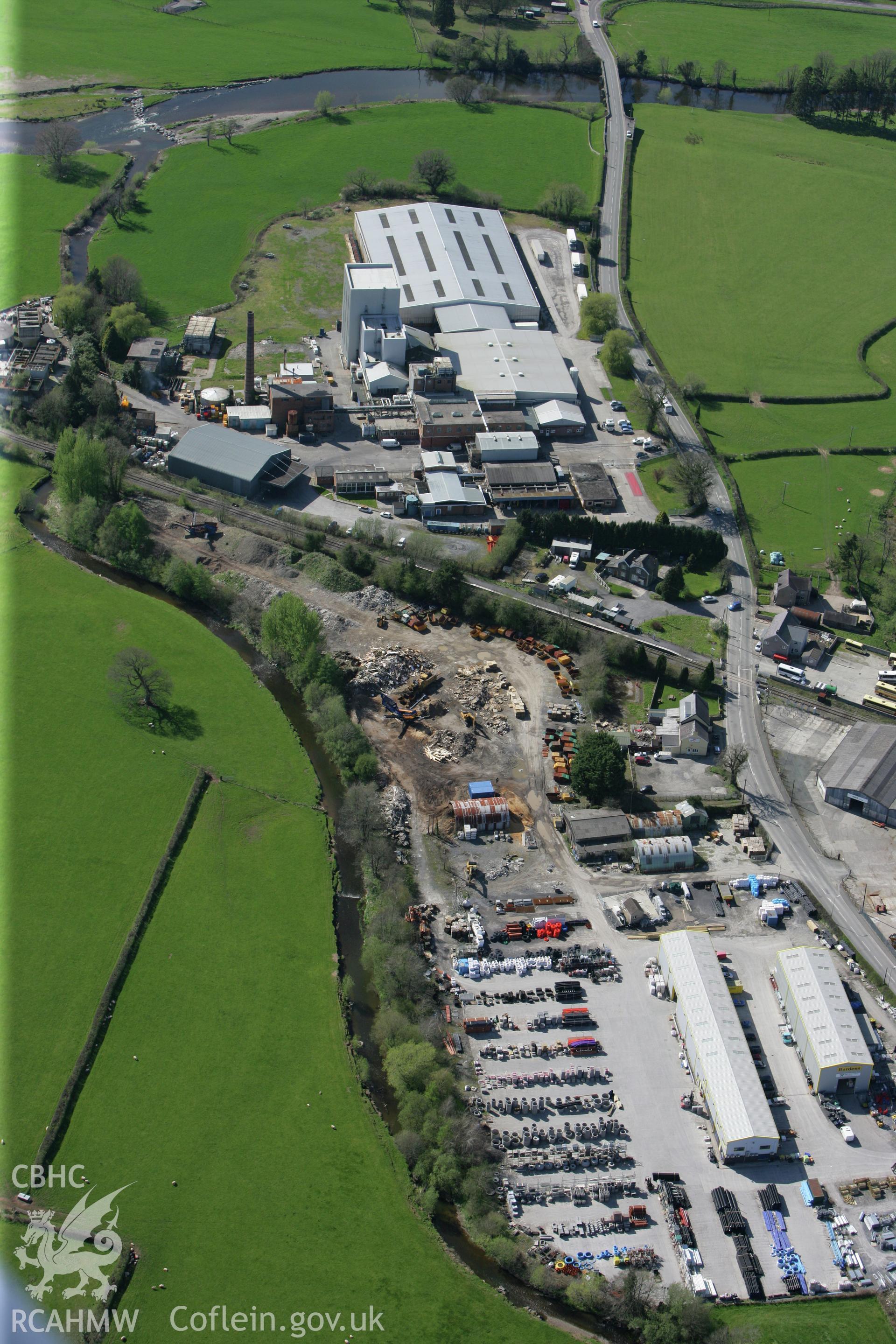 RCAHMW colour oblique photograph of Cws Creamery, Llangadog. Taken by Toby Driver on 08/04/2011.