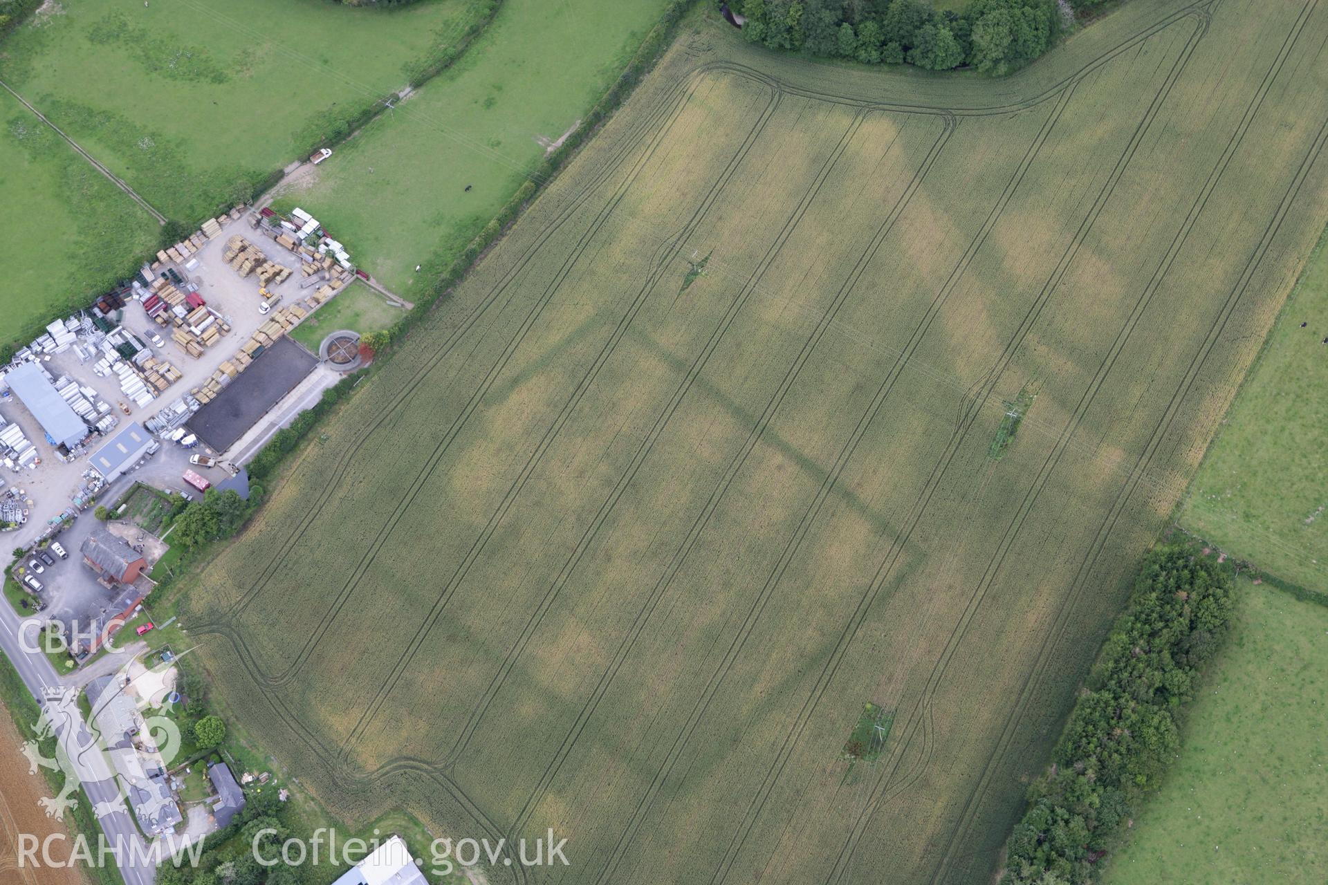 RCAHMW colour oblique photograph of Broadheath Roman villa, cropmark of main enclosure. Taken by Toby Driver on 20/07/2011.