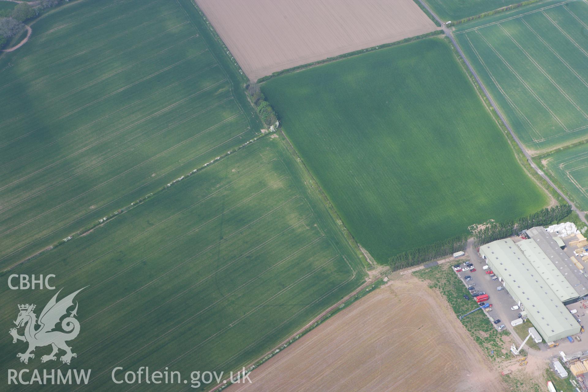 RCAHMW colour oblique photograph of Llancayo Farm Roman marching camp. Taken by Toby Driver on 26/04/2011.