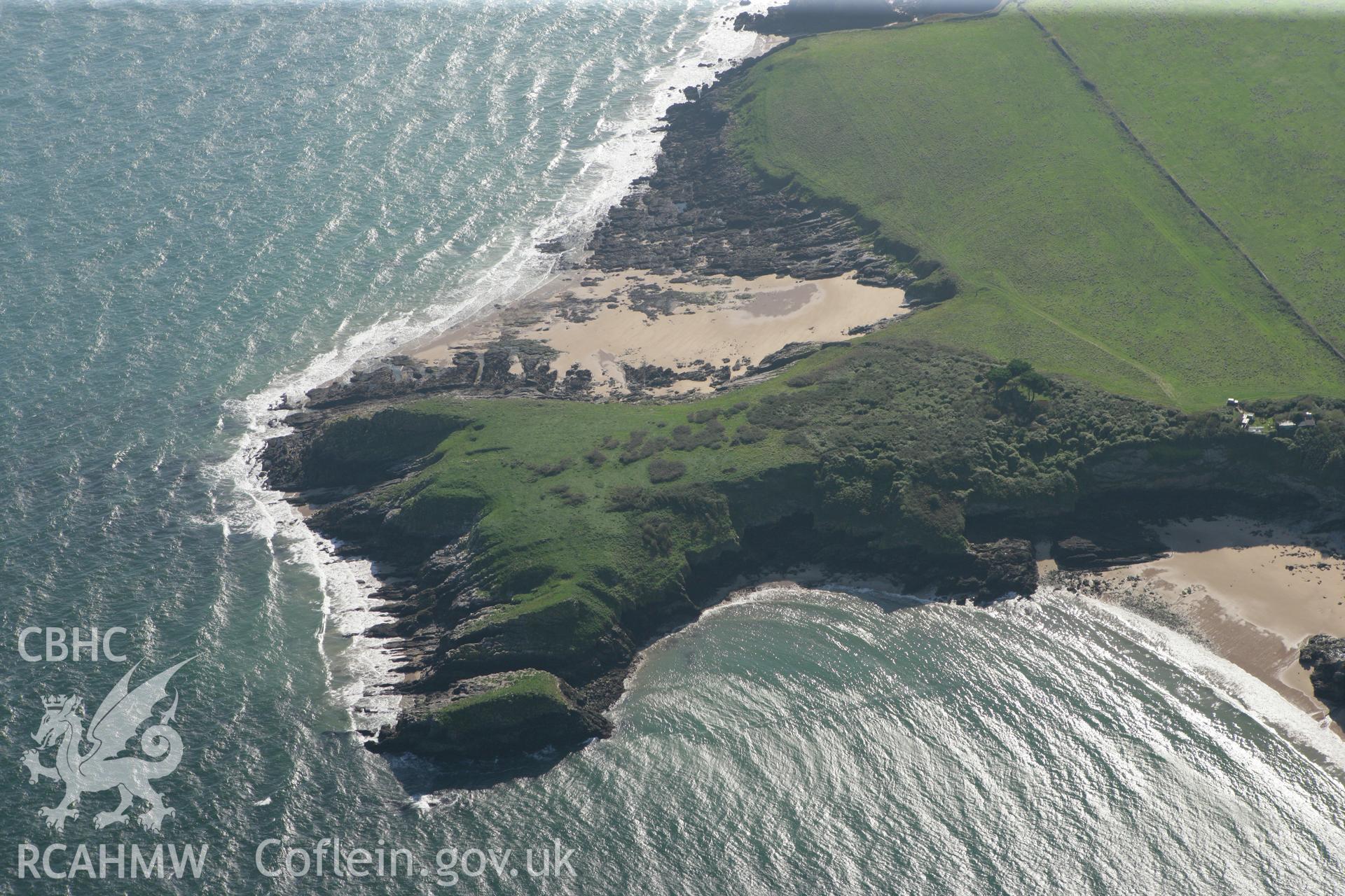 RCAHMW colour oblique photograph of Caldey Point, looking towards Bullum's Bay and Daylight Rock Cave. Taken by Toby Driver and Oliver Davies on 28/09/2011.