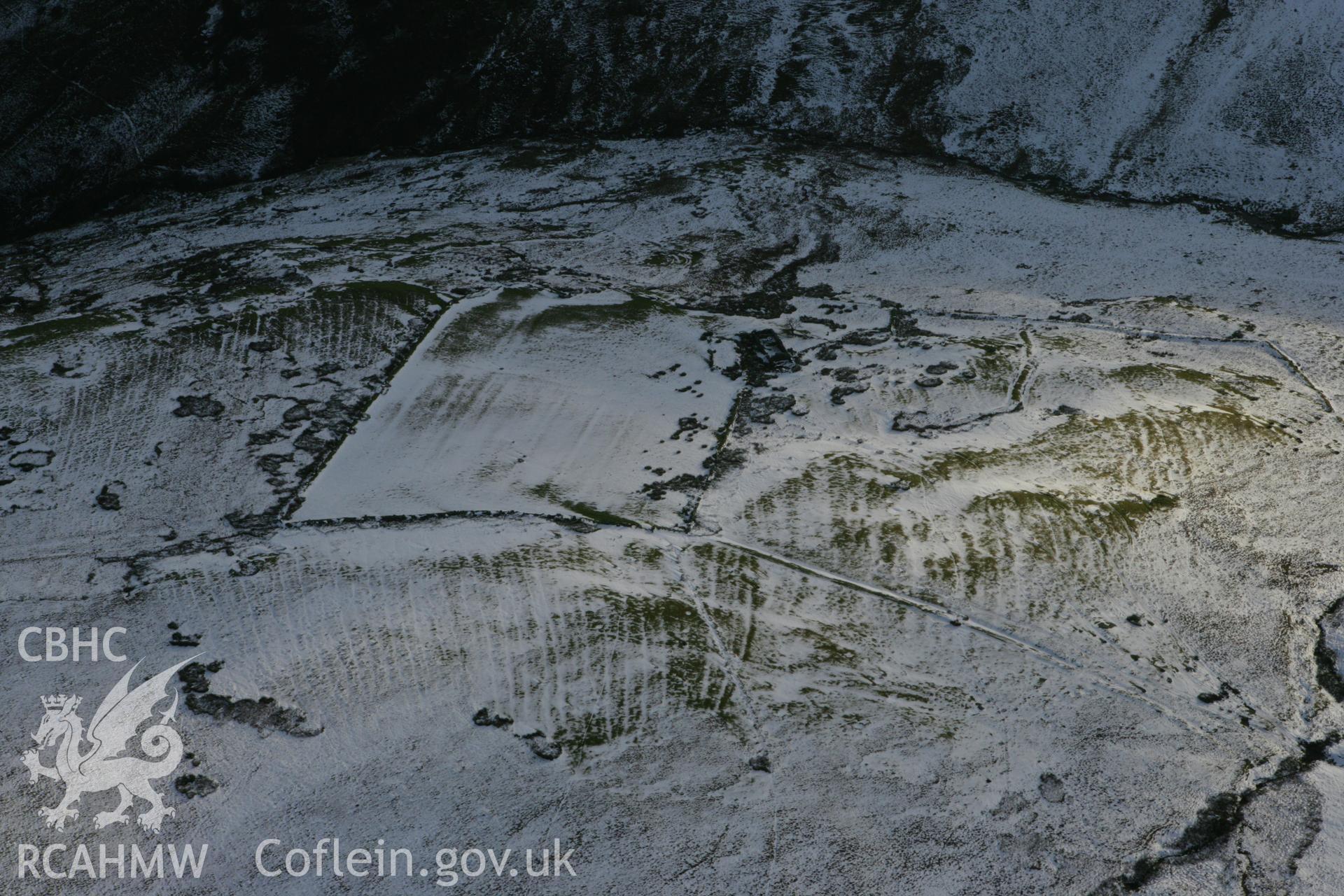 RCAHMW colour oblique photograph of Lluest-Pen-Rhiw, view from north under snow. Taken by Toby Driver on 18/12/2011.