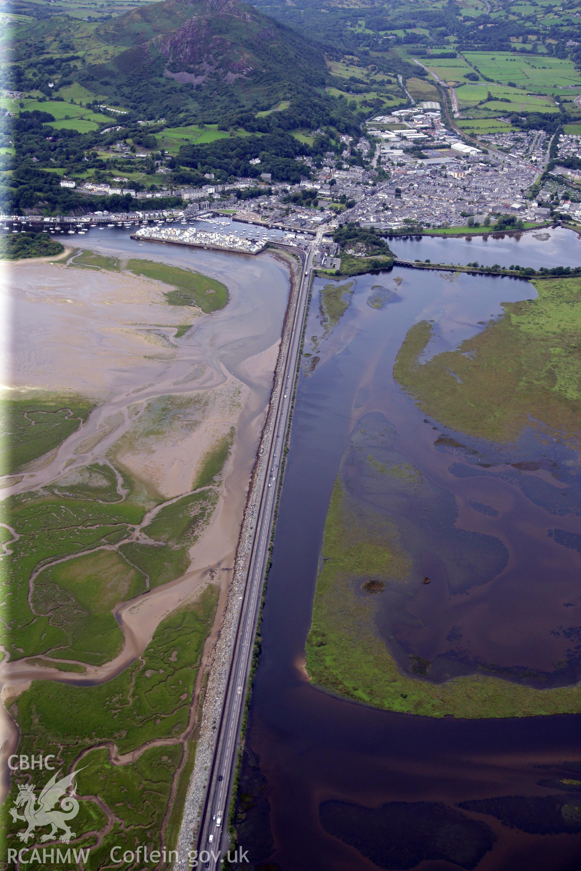 RCAHMW colour oblique photograph of The Cob (Traeth Mawr Embankment), Porthmadog, from the east. Taken by Toby Driver on 17/08/2011.
