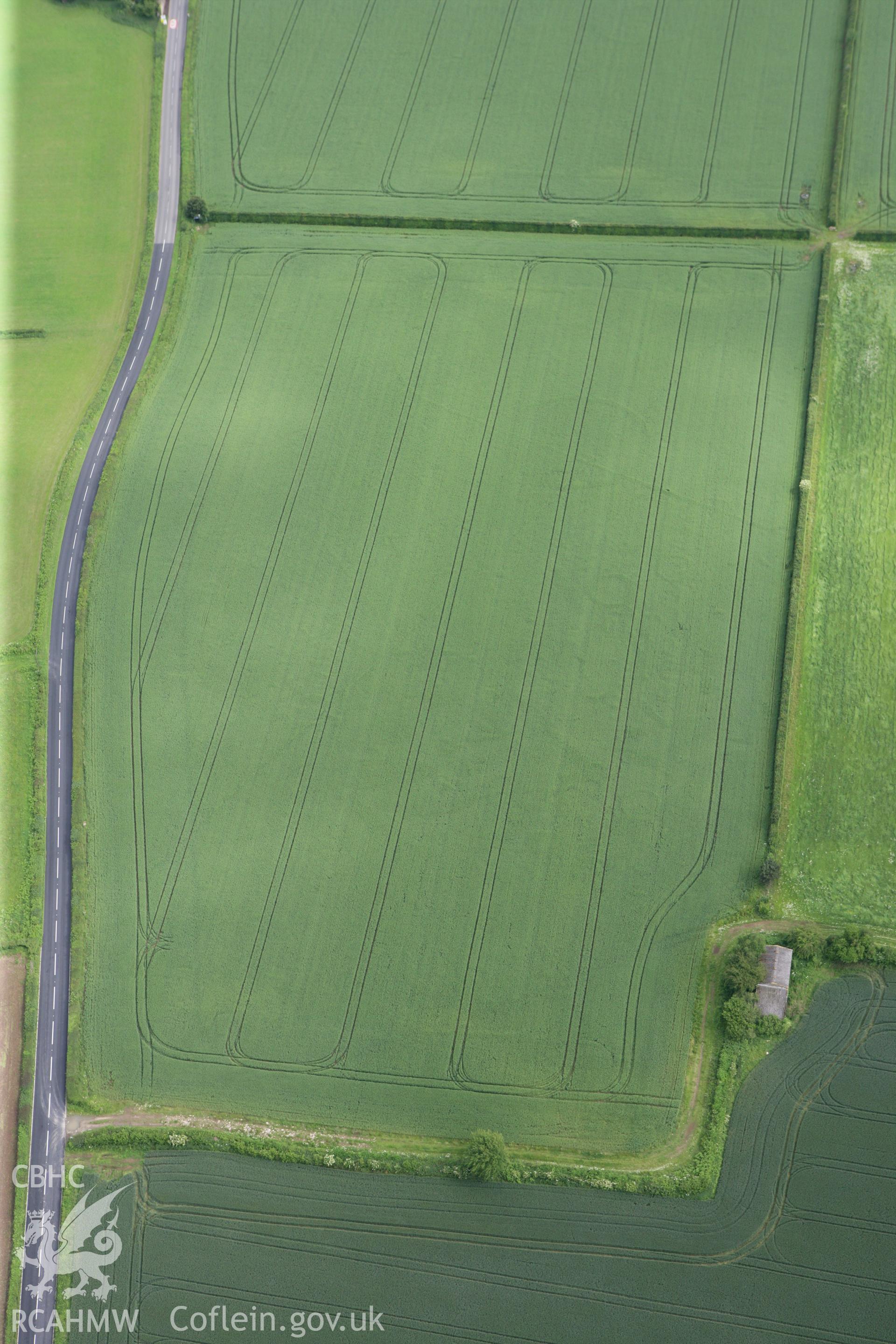 RCAHMW colour oblique photograph of Llancayo Farm barrow cemetery. Taken by Toby Driver on 13/06/2011.