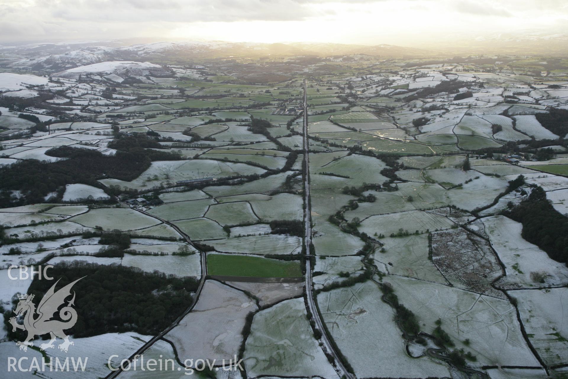 RCAHMW colour oblique photograph of Central Wales line, looking south-west over Dolau. Taken by Toby Driver on 18/12/2011.