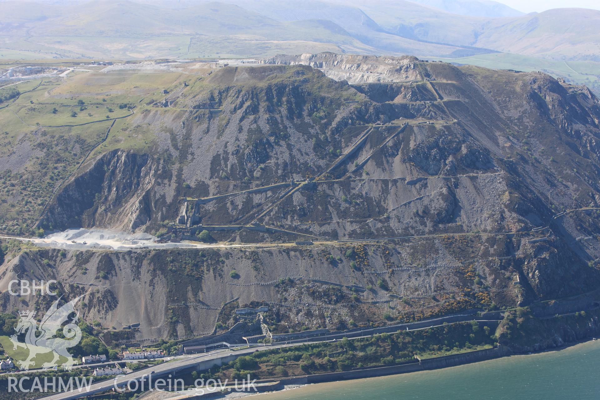 RCAHMW colour oblique photograph of Penmaenmawr Granite Quarry. Taken by Toby Driver on 03/05/2011.