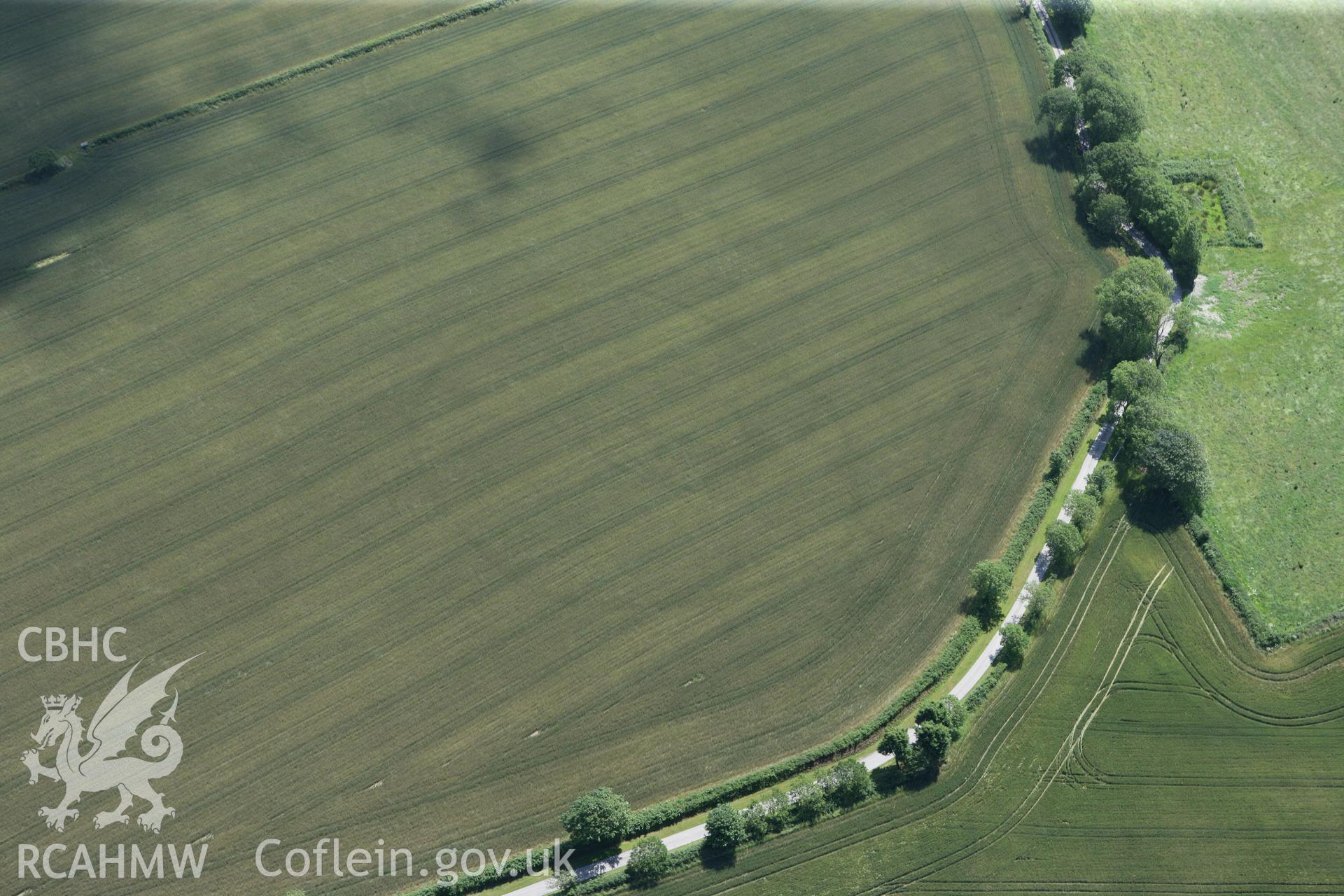 RCAHMW colour oblique photograph of Cawrence Cropmark Enclosure. Taken by Toby Driver and Oliver Davies on 28/06/2011.