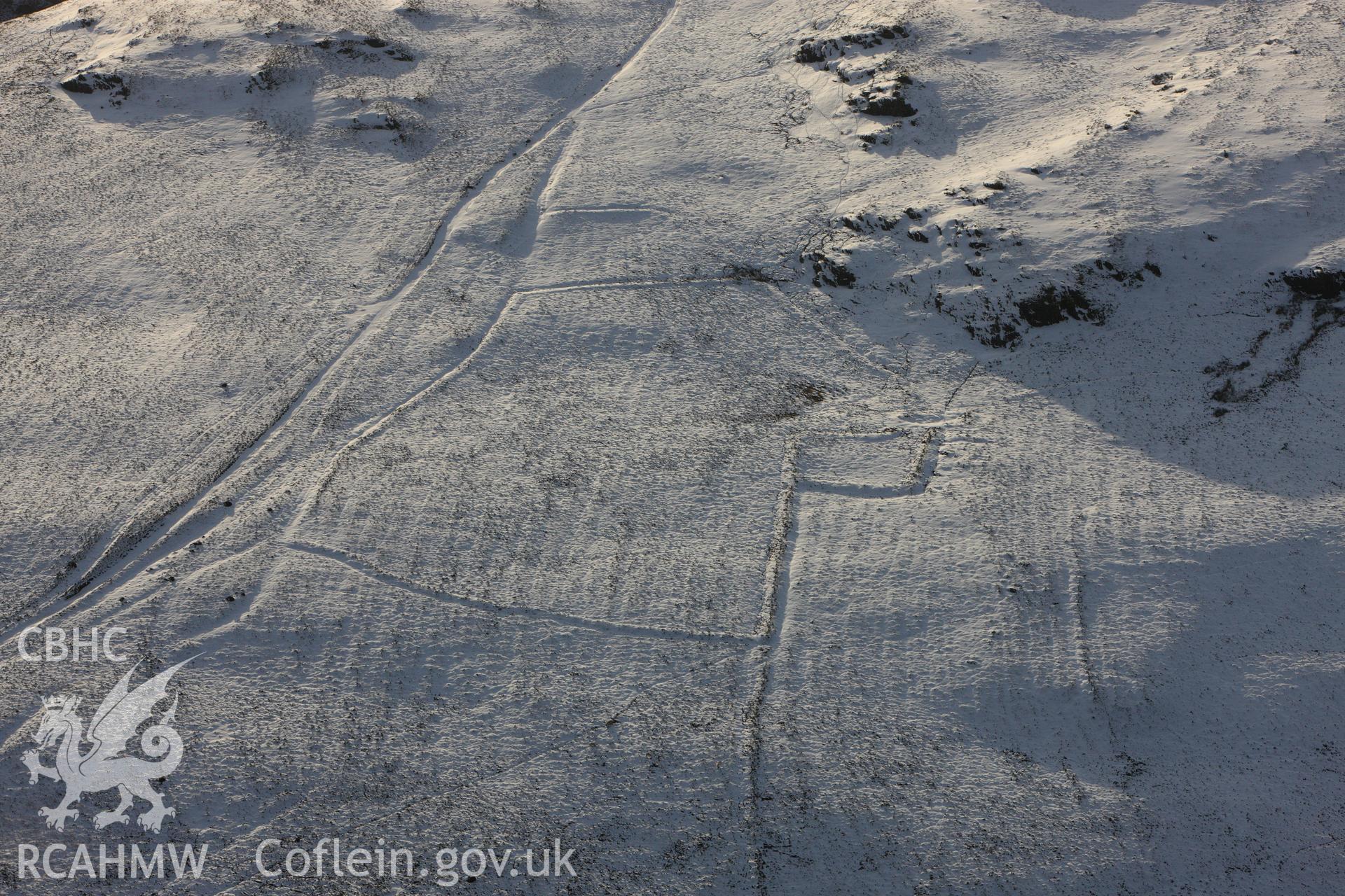 RCAHMW colour oblique photograph of Moelfryn, Nannerth, deserted rural settlement under snow. Taken by Toby Driver on 18/12/2011.