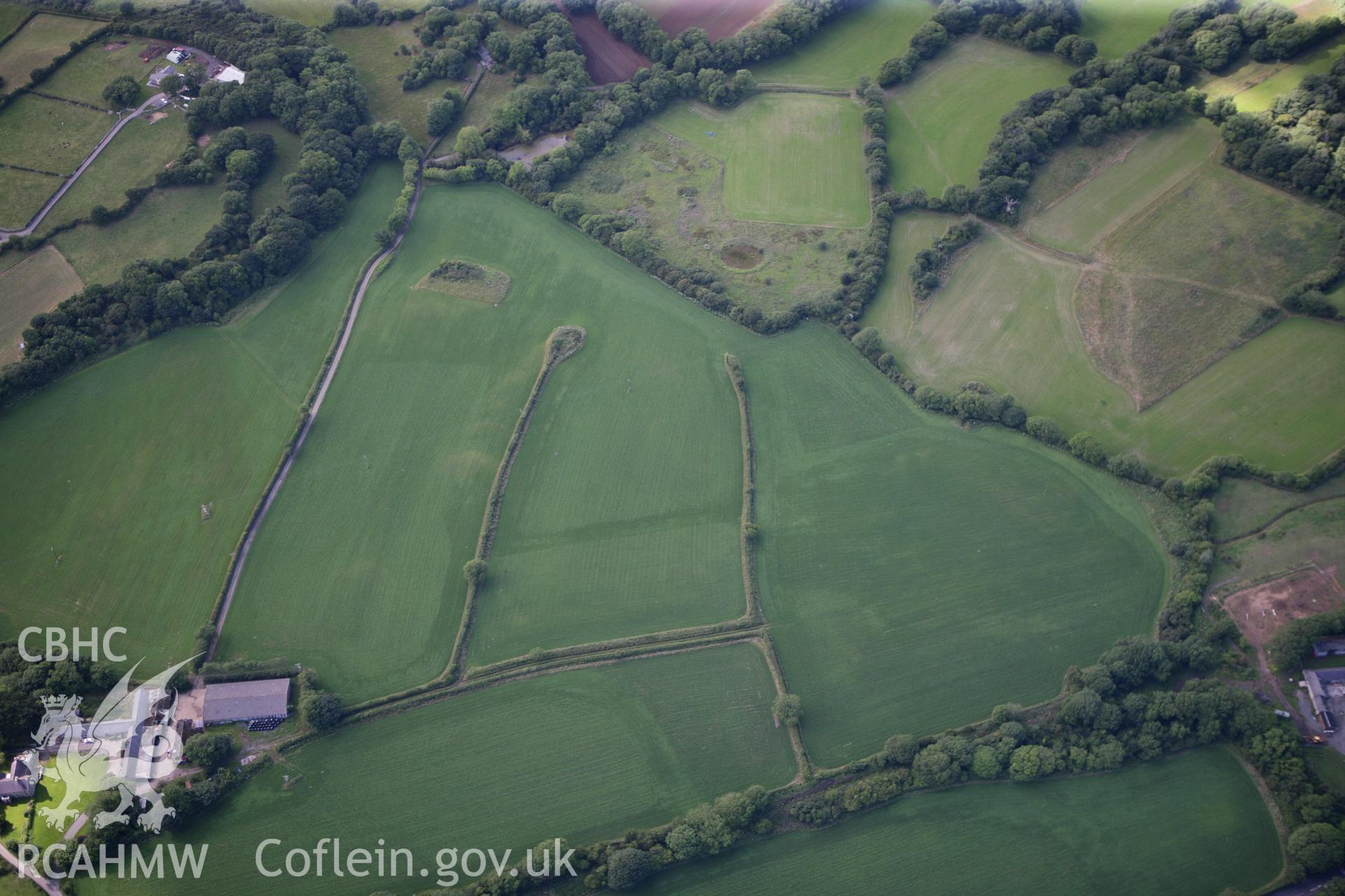 RCAHMW colour oblique photograph of Glyn, Llanbedrgoch, fields to south of main enclosure. Taken by Toby Driver on 20/07/2011.