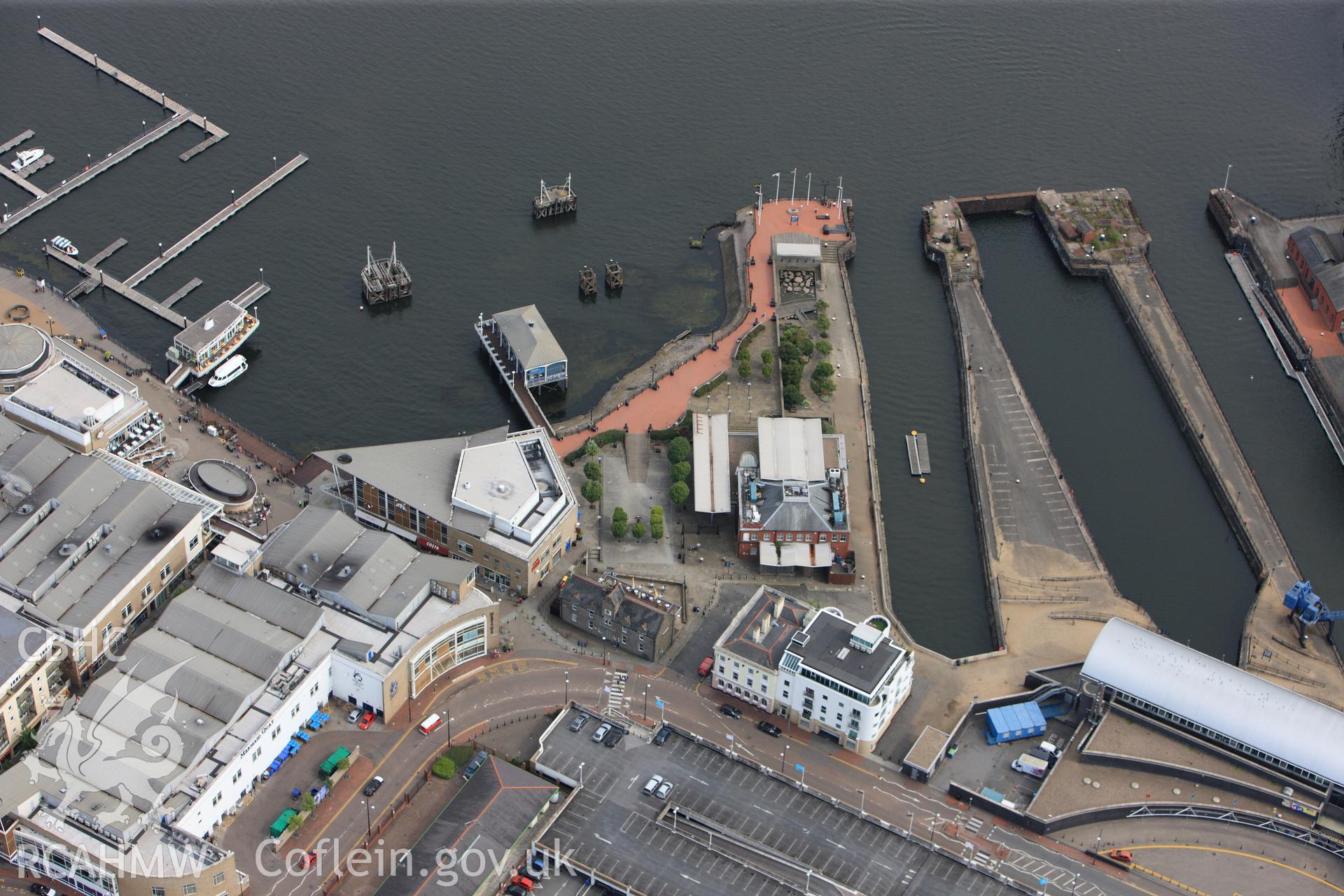 RCAHMW colour oblique photograph of Mount Stuart Graving Docks. Taken by Toby Driver on 13/06/2011.