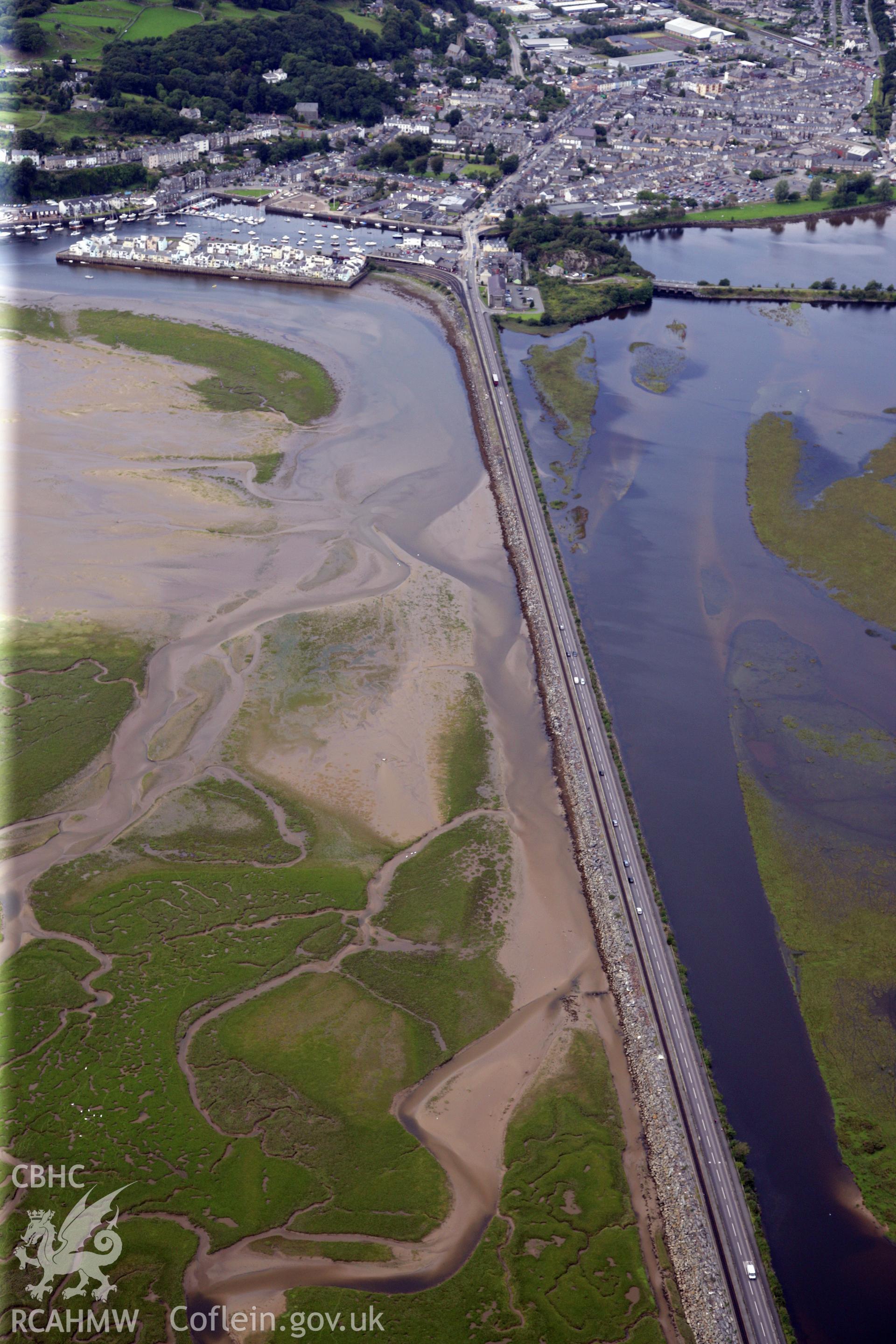 RCAHMW colour oblique photograph of The Cob (Traeth Mawr Embankment), Porthmadog, from the east. Taken by Toby Driver on 17/08/2011.