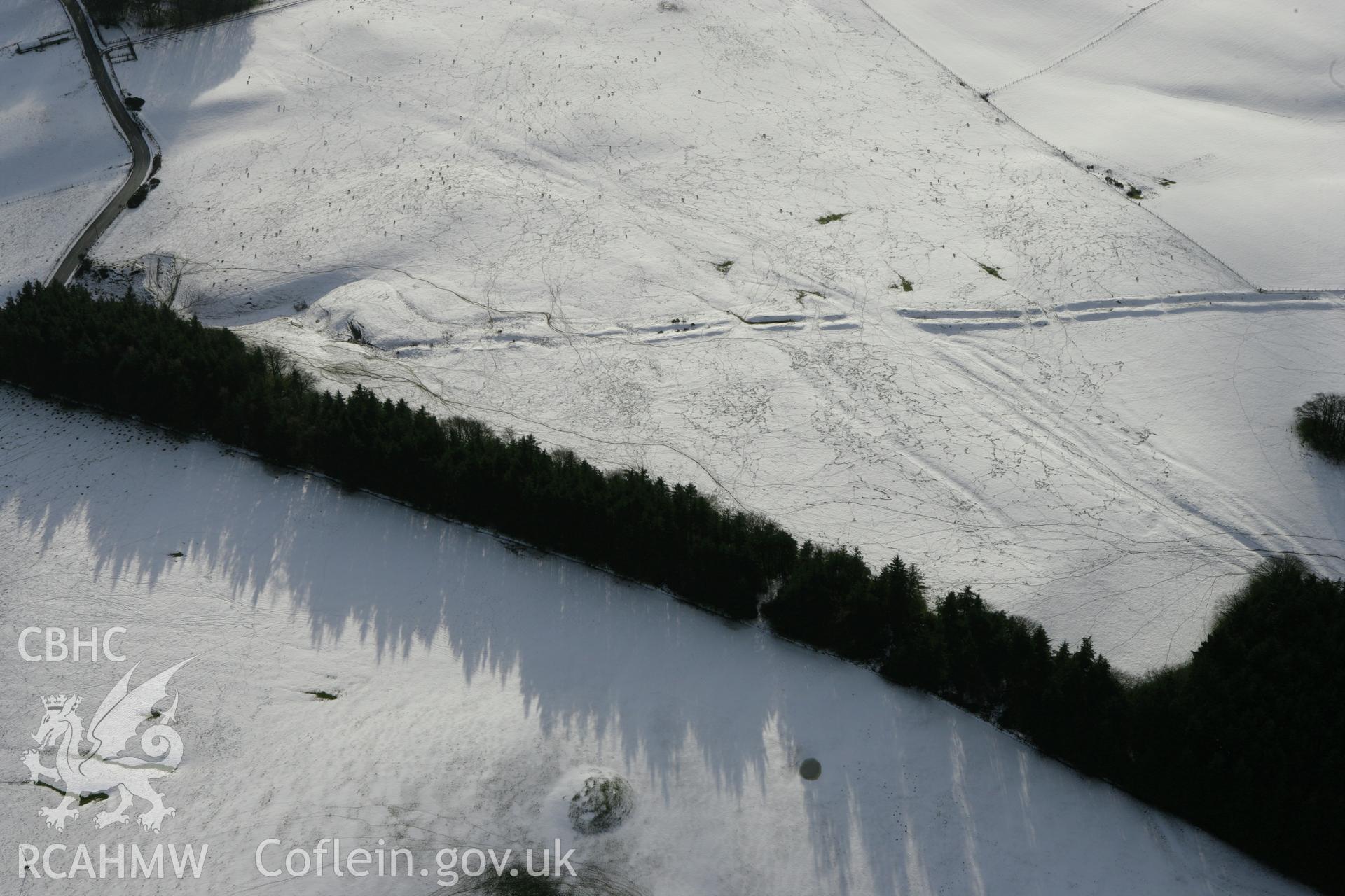 RCAHMW colour oblique photograph of Crugyn Bank, under snow, with round barrows. Taken by Toby Driver on 18/12/2011.