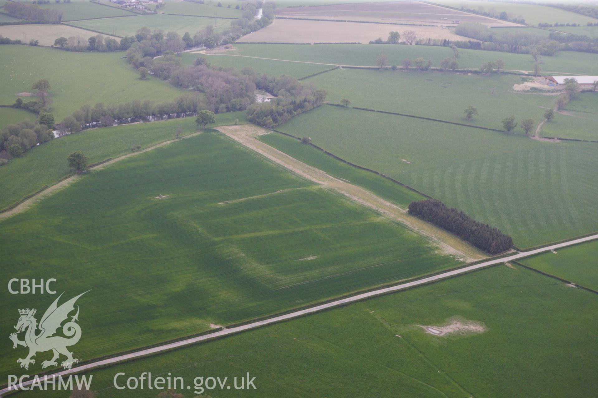 RCAHMW colour oblique photograph of Forden Gaer Roman settlement, with cropmarks showing. Taken by Toby Driver on 26/04/2011.