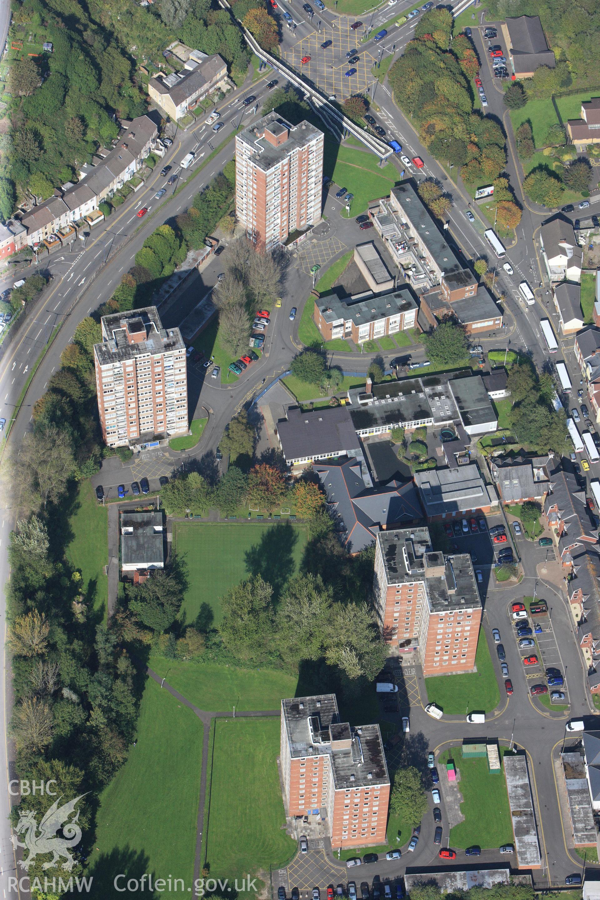 RCAHMW colour oblique photograph of post-war tower blocks, Dyfatty, Swansea, with Ysgol Crug Glas. Taken by Toby Driver and Oliver Davies on 28/09/2011.