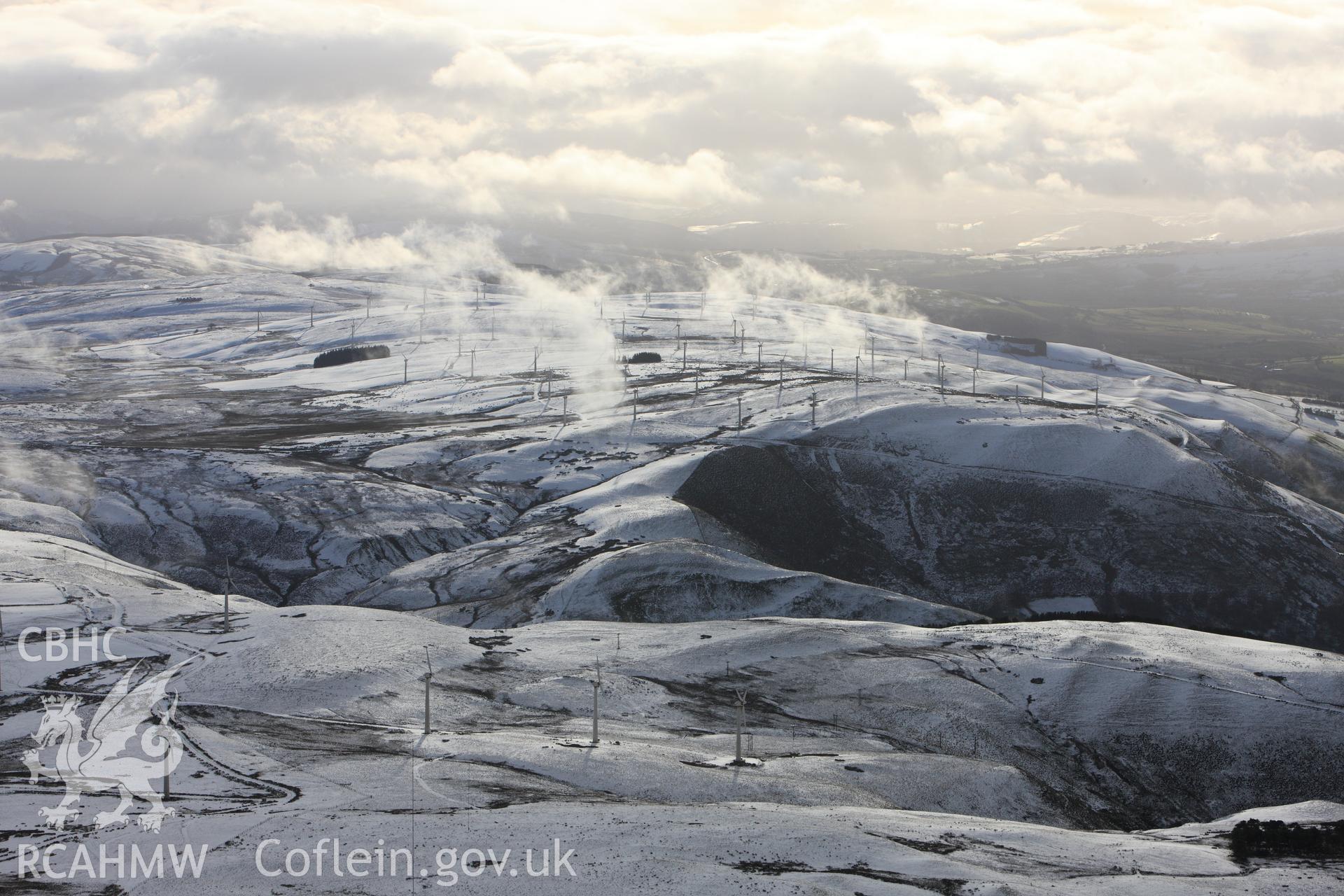 RCAHMW colour oblique photograph of Dethenydd windfarm, view under snow, looking south. Taken by Toby Driver on 18/12/2011.