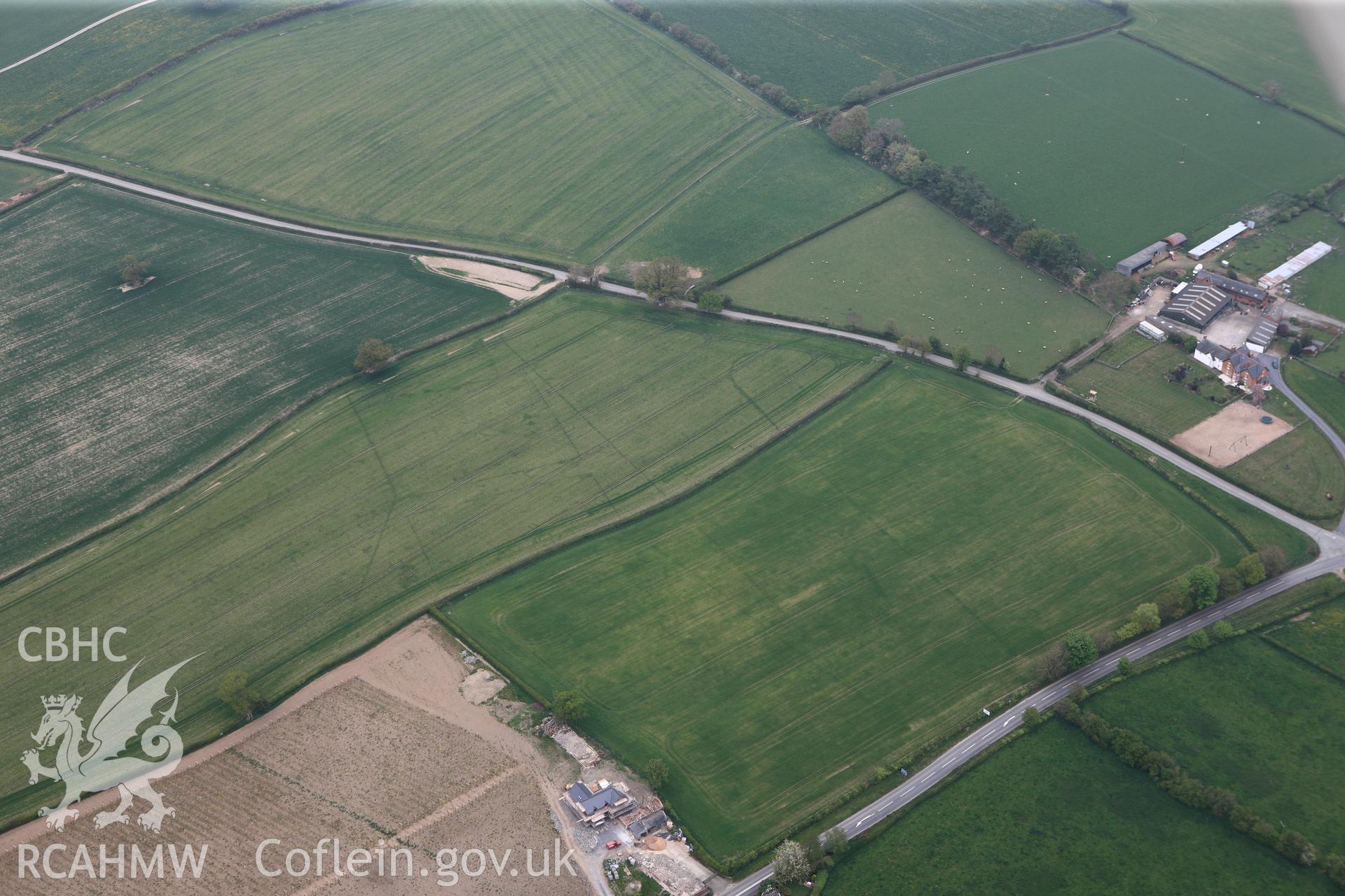 RCAHMW colour oblique photograph of Brompton or Pentrehyling Roman marching camps. Taken by Toby Driver on 26/04/2011.