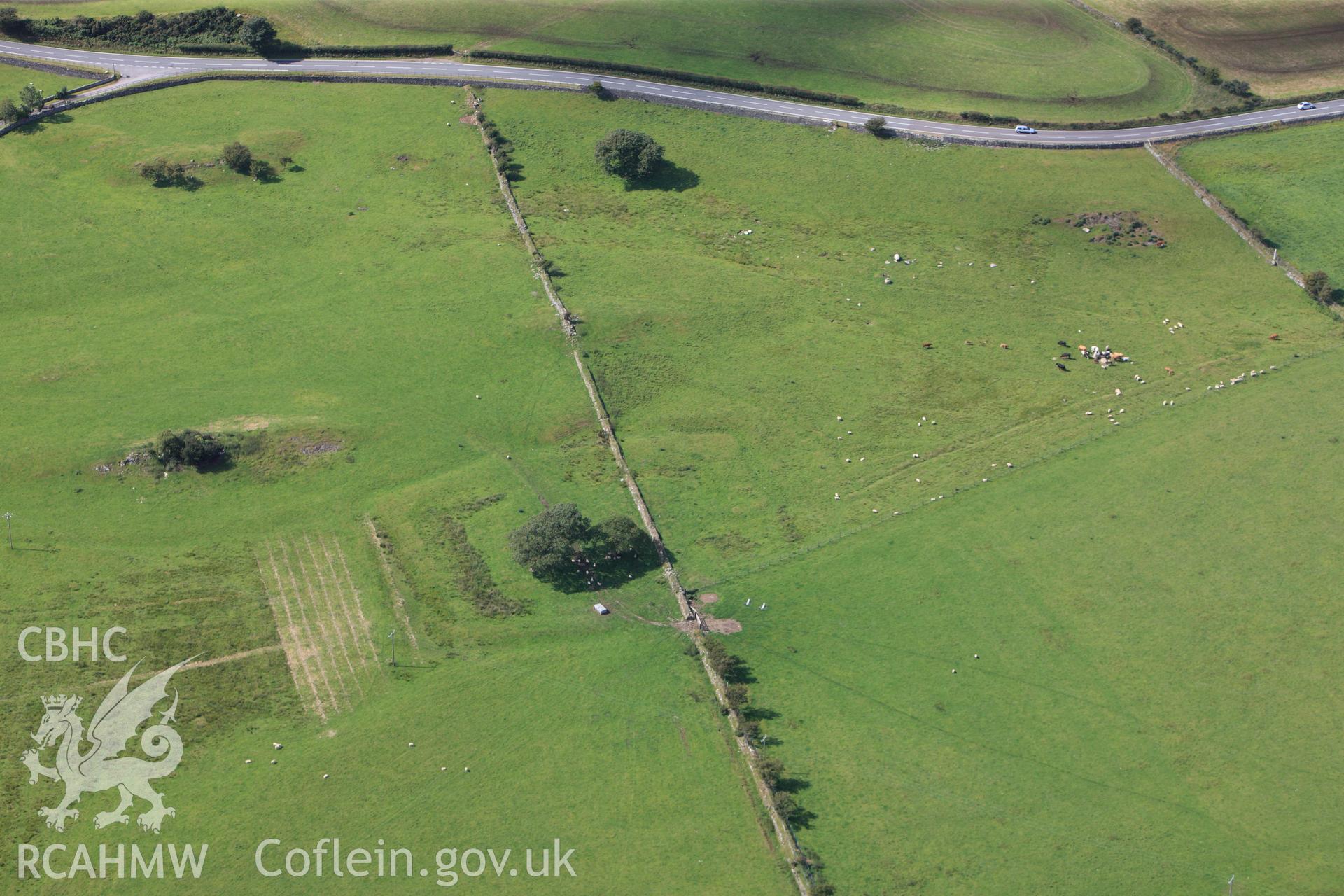 RCAHMW colour oblique photograph of Coed Ty Mawr moated site. Taken by Toby Driver on 20/07/2011.