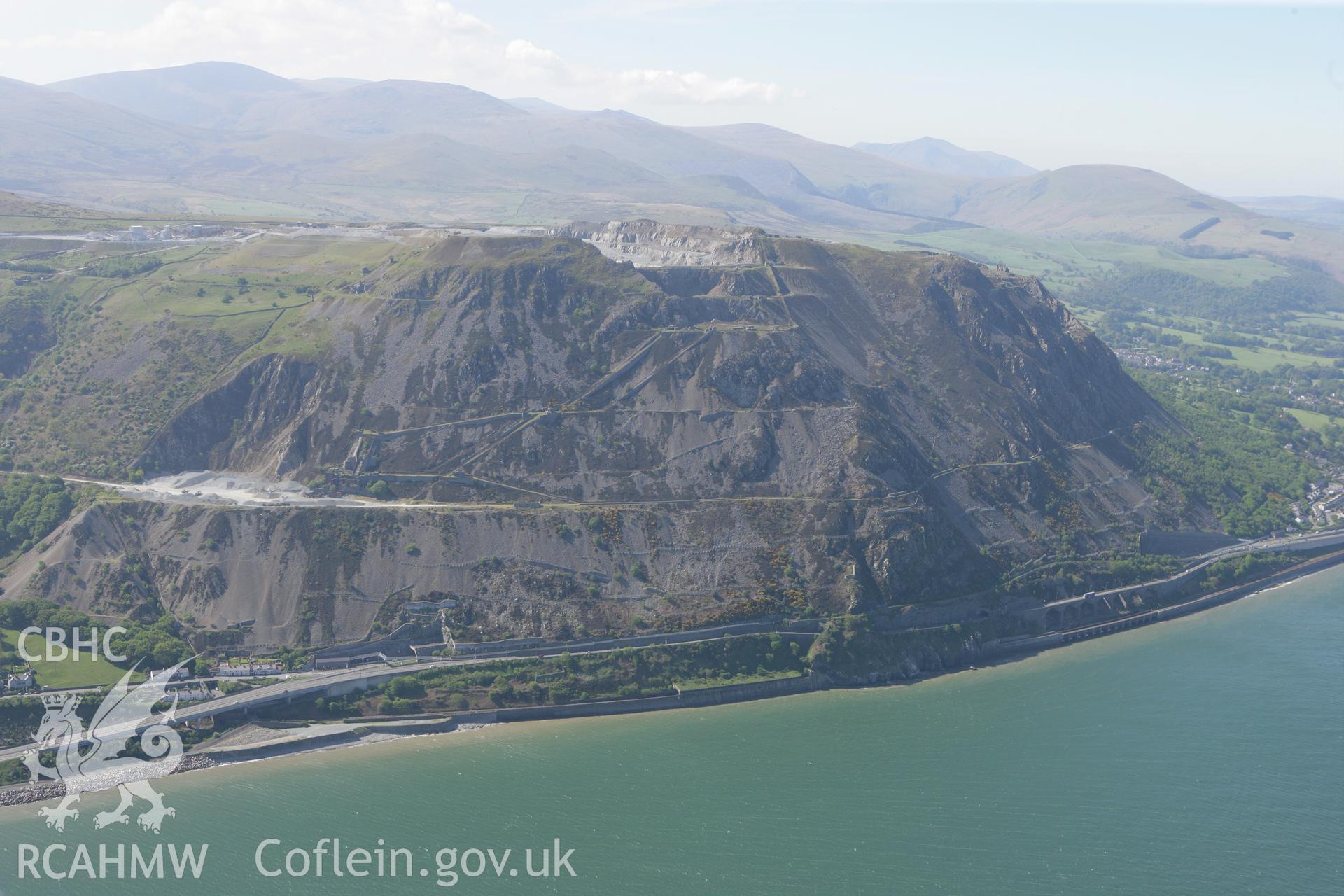 RCAHMW colour oblique photograph of Penmaenmawr Granite Quarry. Taken by Toby Driver on 03/05/2011.