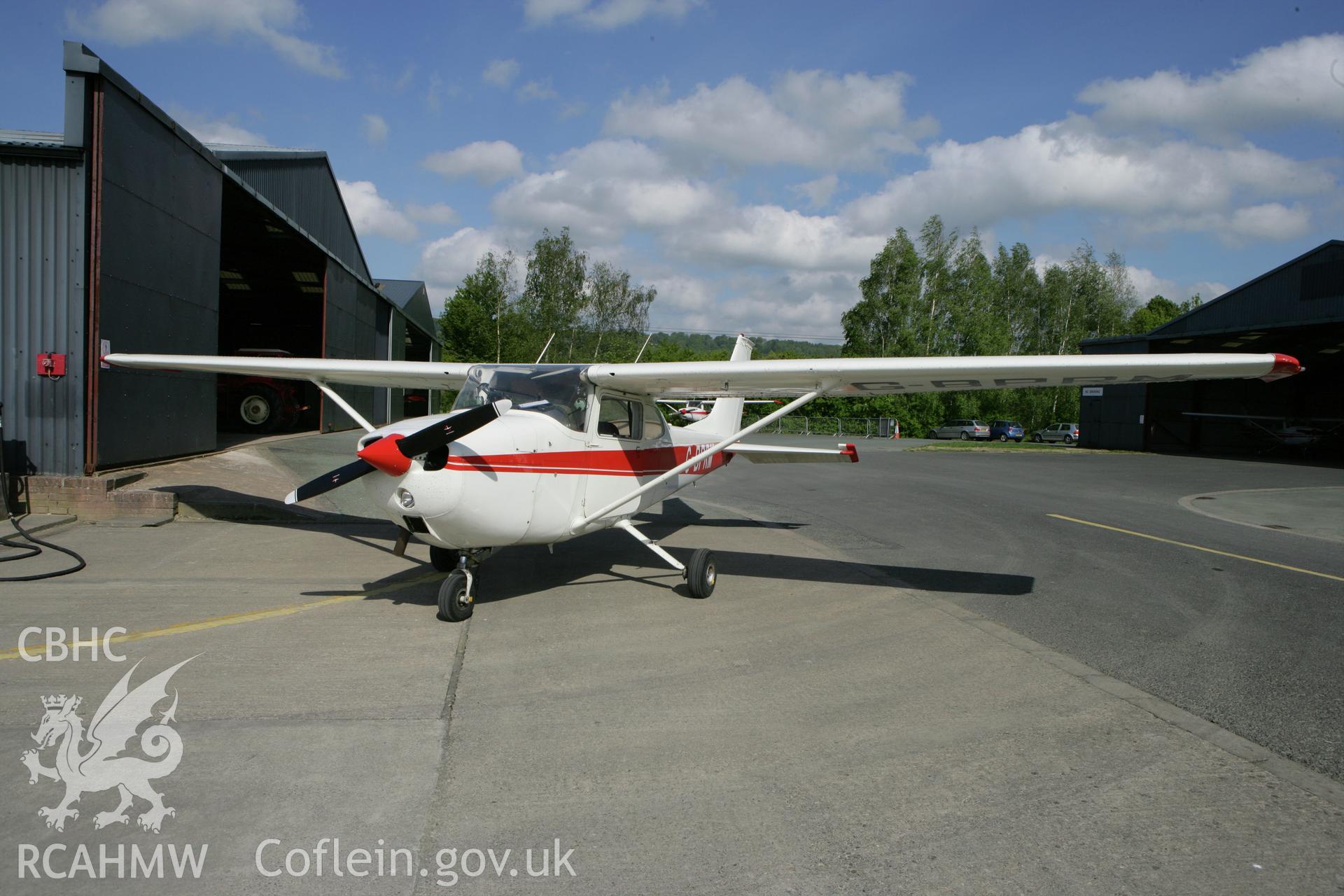 RCAHMW colour oblique photograph of Cessna at Montgomeryshire Mid Wales Airport. Taken by Toby Driver on 03/05/2011.
