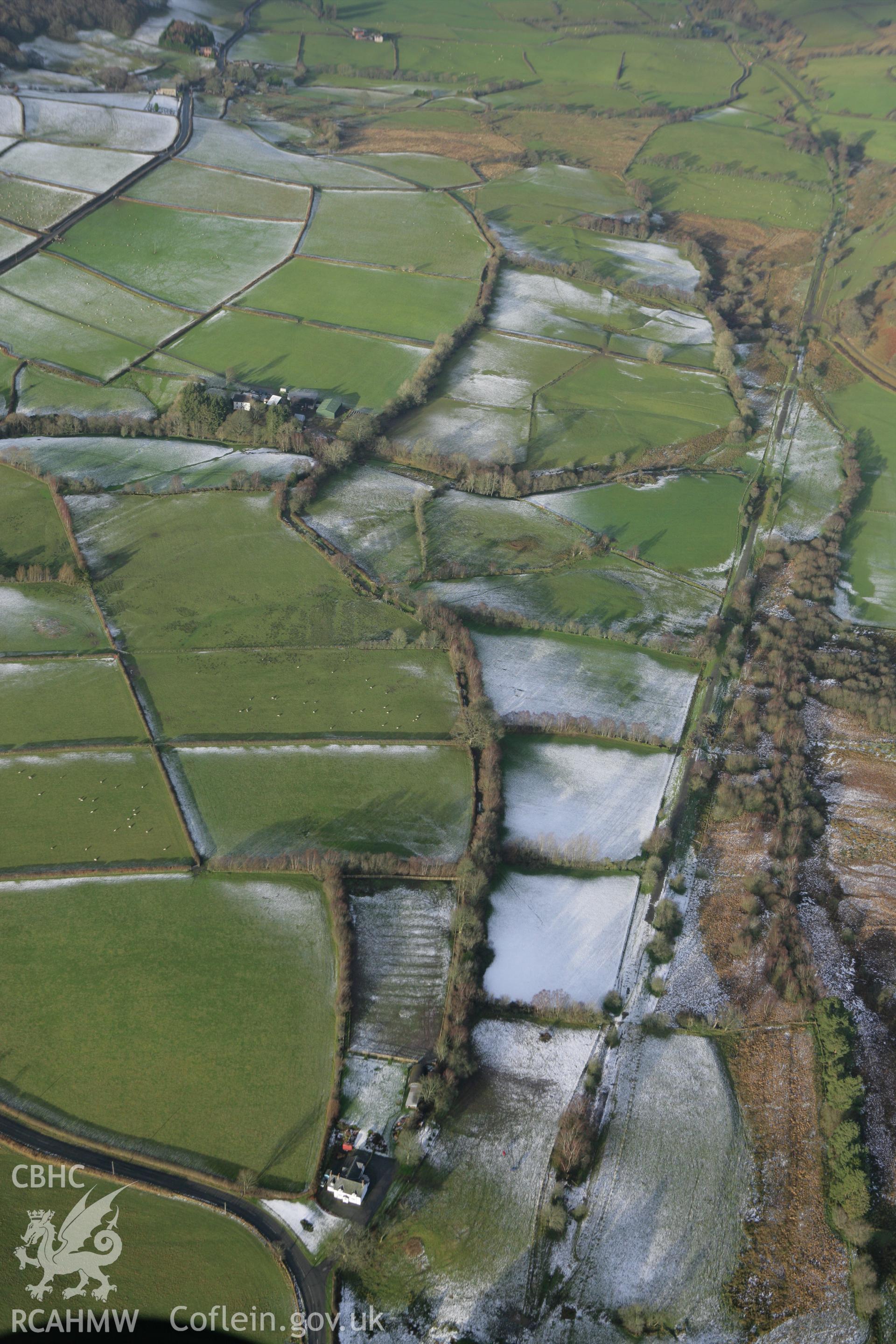 RCAHMW colour oblique photograph of Llwyn-y-brain, line of Roman road, looking north. Taken by Toby Driver on 18/12/2011.