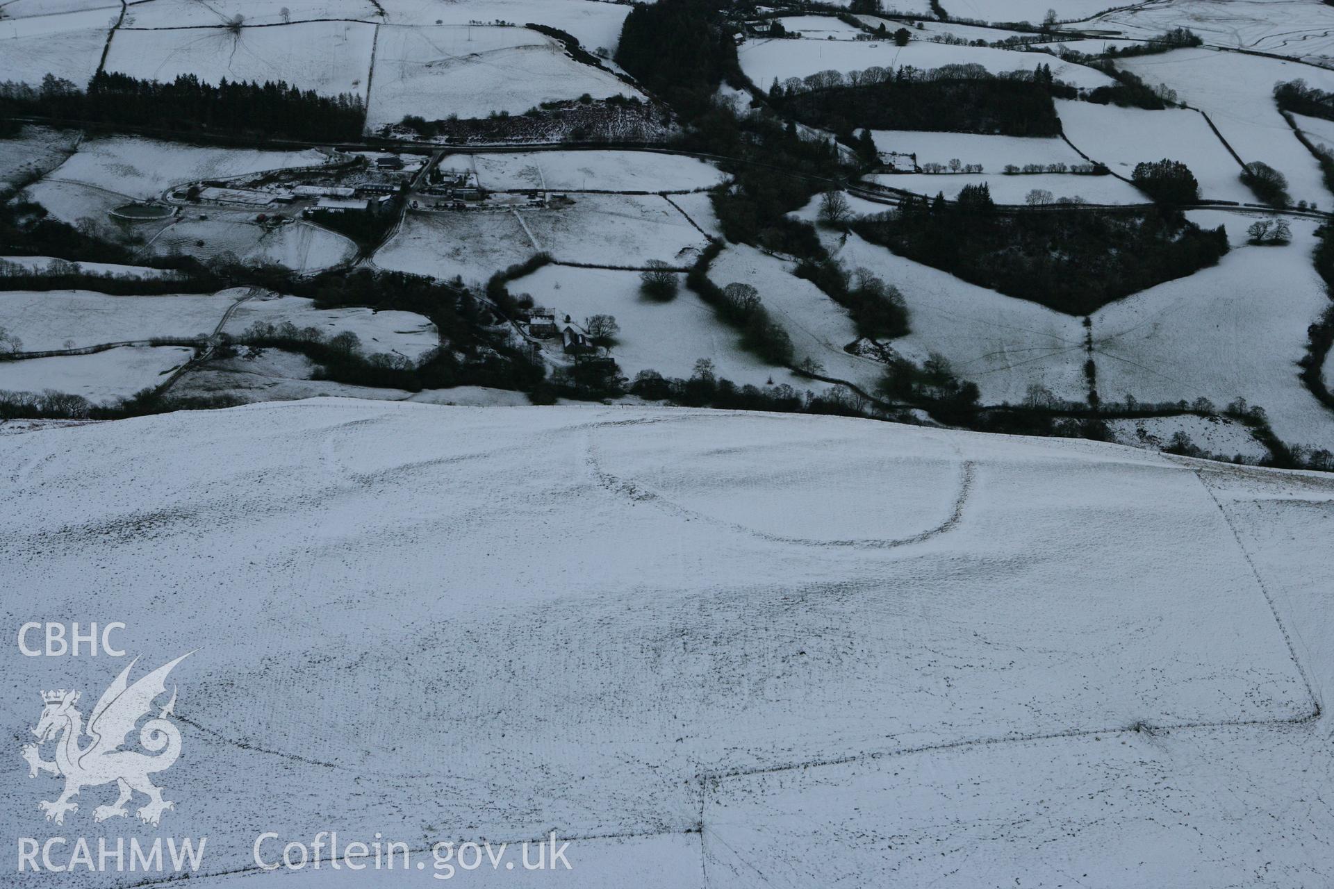 RCAHMW colour oblique photograph of Llyssin hillfort, SAM recommendation. Taken by Toby Driver on 18/12/2011.