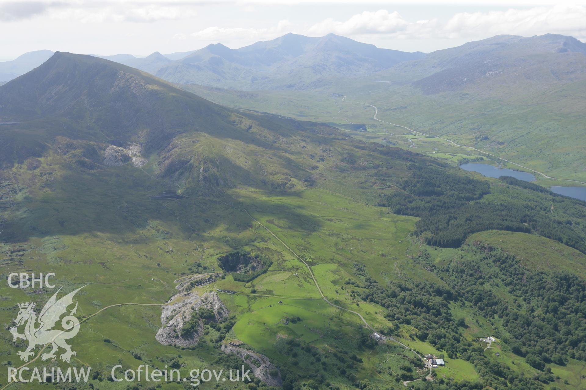 RCAHMW colour oblique photograph of Rhos Quarry, and landscape west to Llynnau Mymbyr. Taken by Toby Driver on 20/07/2011.
