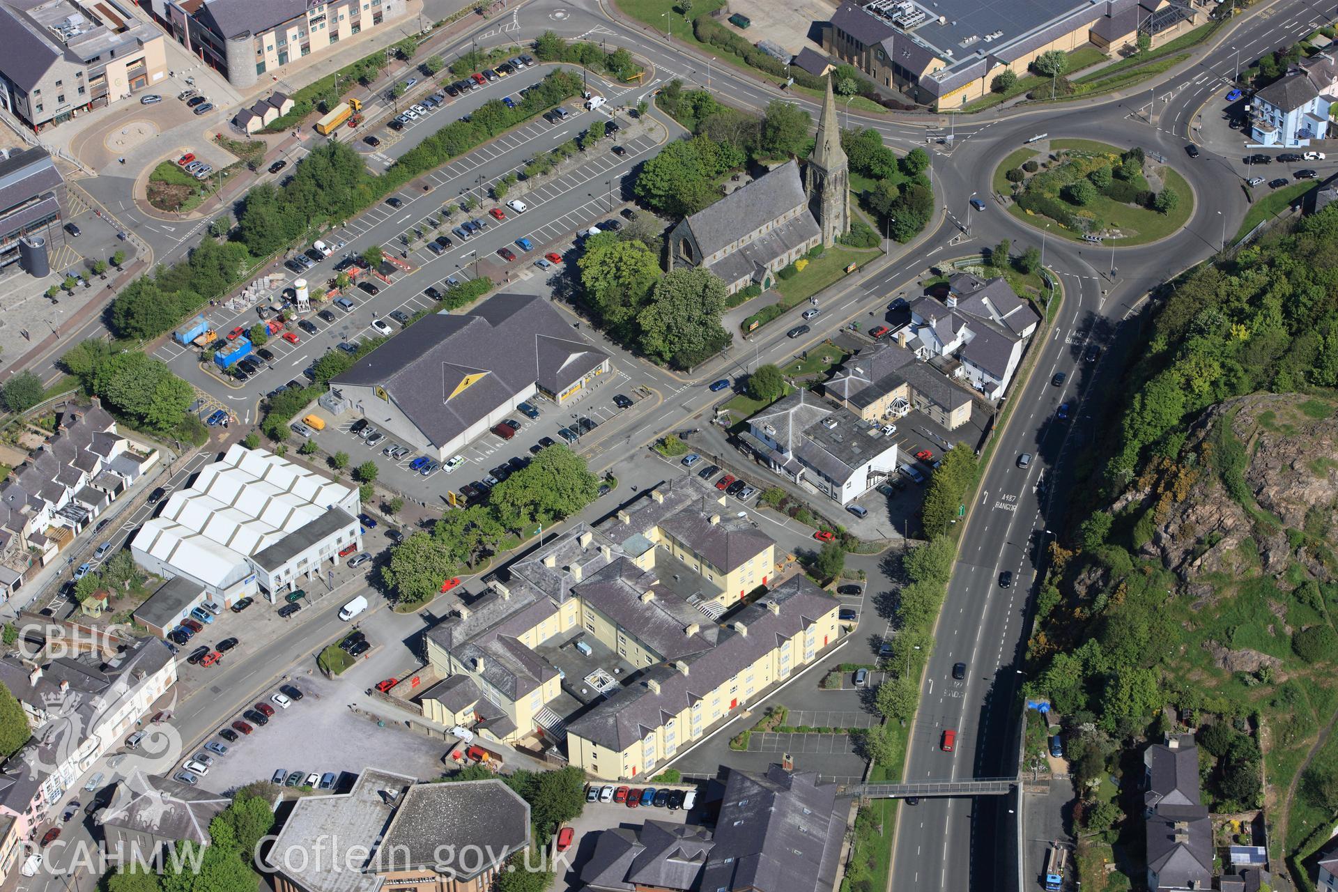 RCAHMW colour oblique photograph of Christ Church, North Road, Caernarfon, with the former Royal Hotel. Taken by Toby Driver on 03/05/2011.