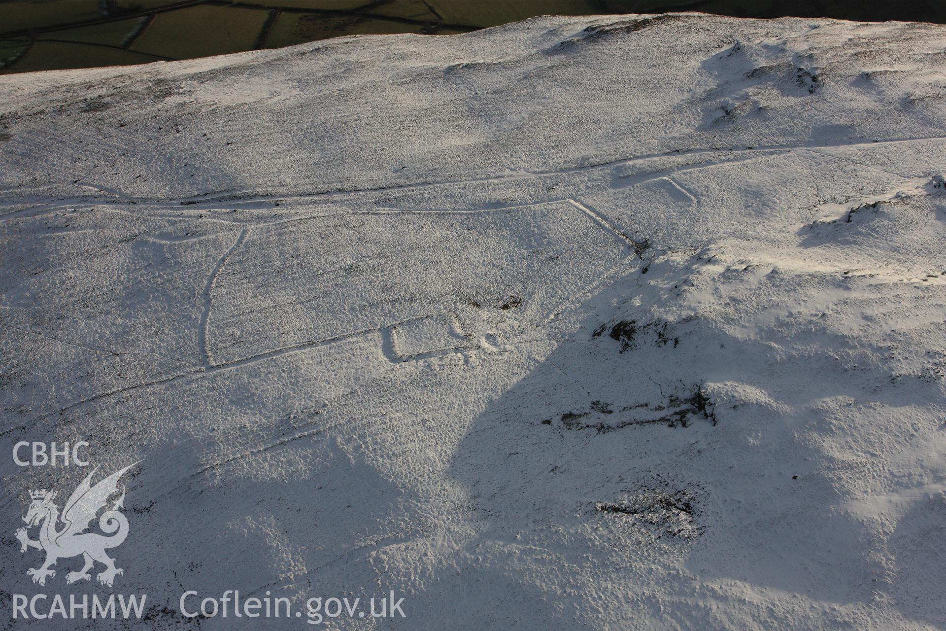 RCAHMW colour oblique photograph of Moelfryn, Nannerth, deserted rural settlement under snow. Taken by Toby Driver on 18/12/2011.