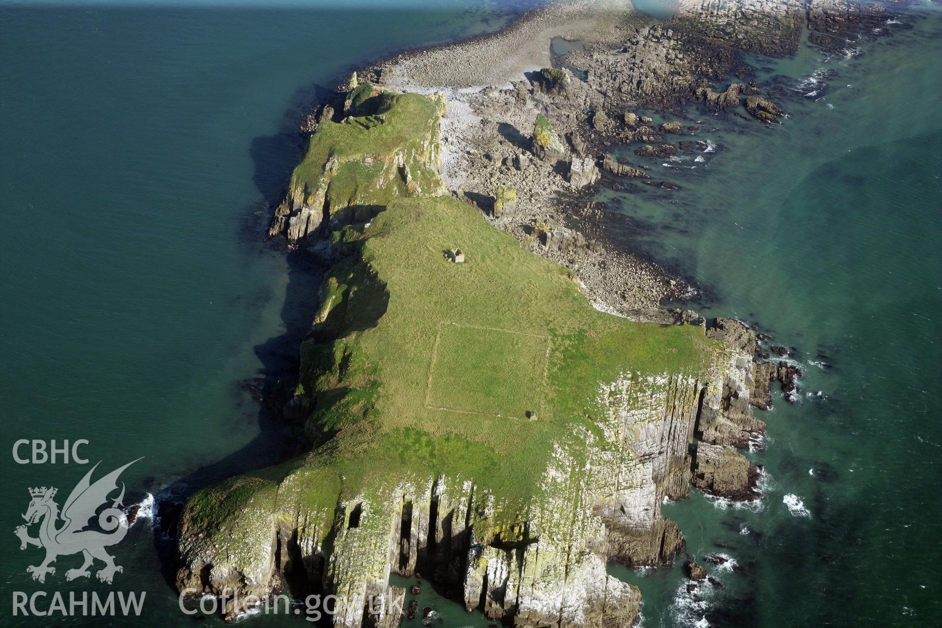 RCAHMW colour oblique photograph of monastic buildings and chapel ruins and field enclosure, St Margaret's Island. Taken by Toby Driver and Oliver Davies on 28/09/2011.