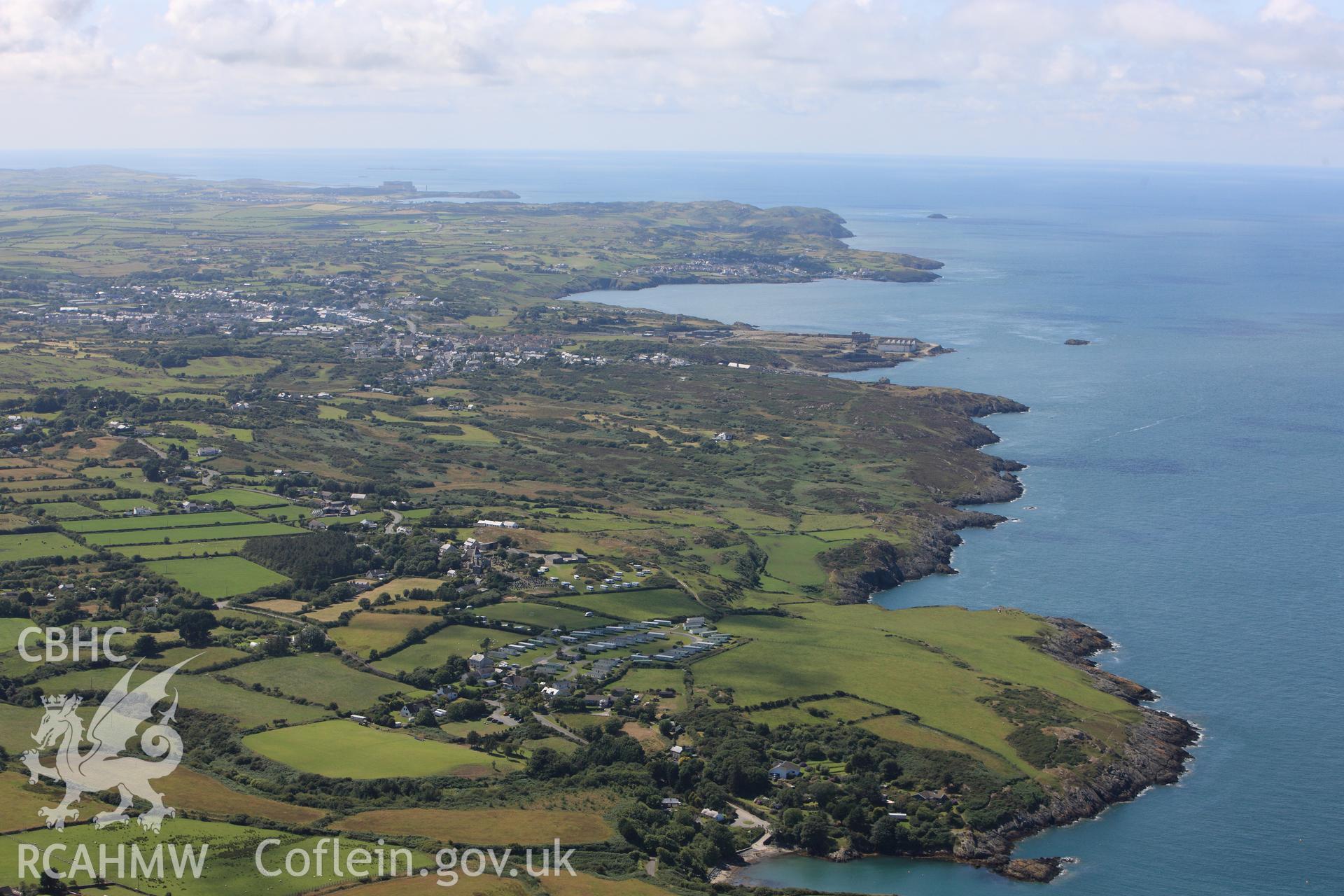 RCAHMW colour oblique photograph of Porth Amlwch, view from east over Llaneilian. Taken by Toby Driver on 20/07/2011.