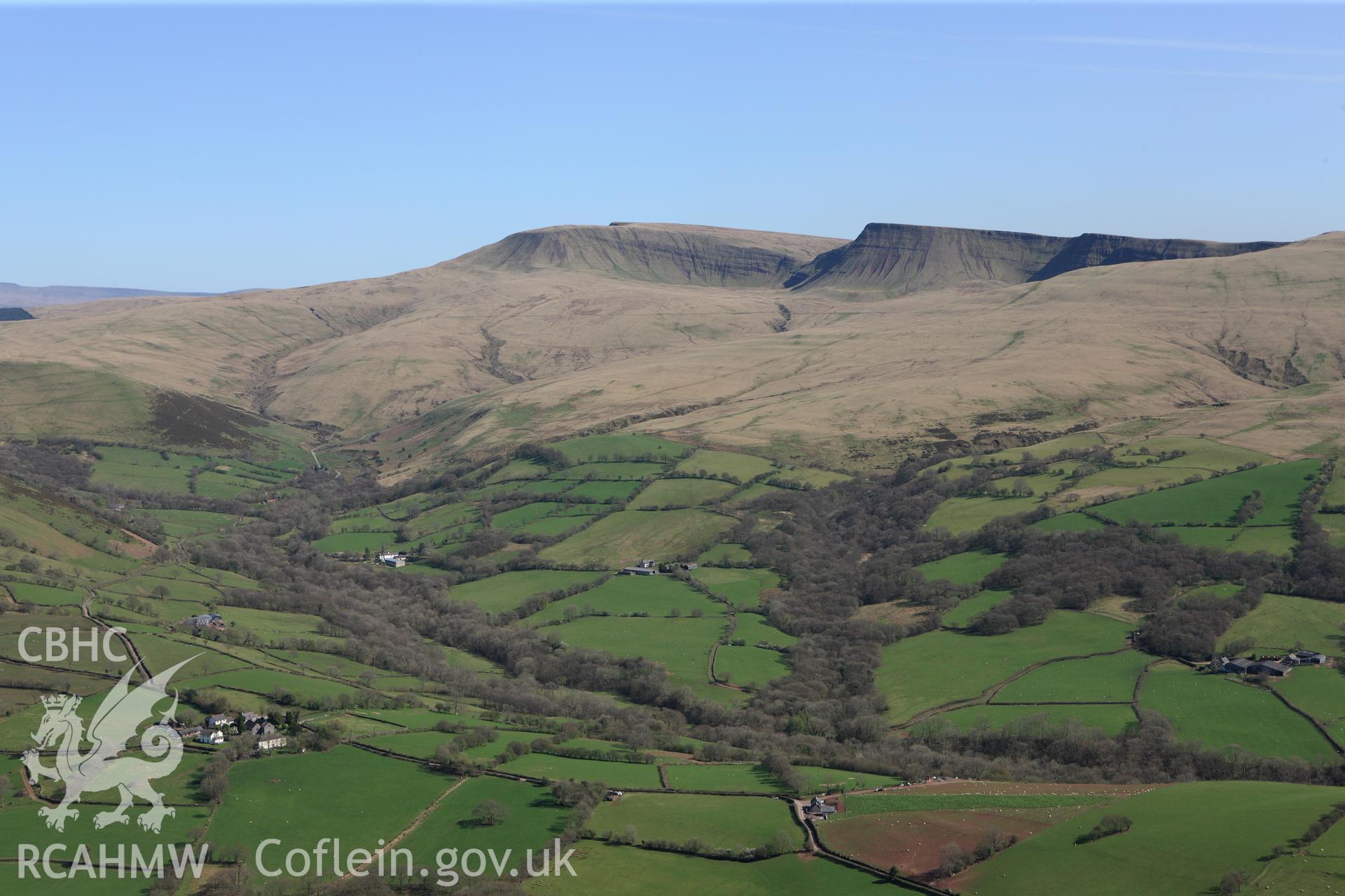 RCAHMW colour oblique photograph of View of Saints Simono and Jude's Church, Llanddeusant, looking south towards Black Mountains. Taken by Toby Driver on 08/04/2011.