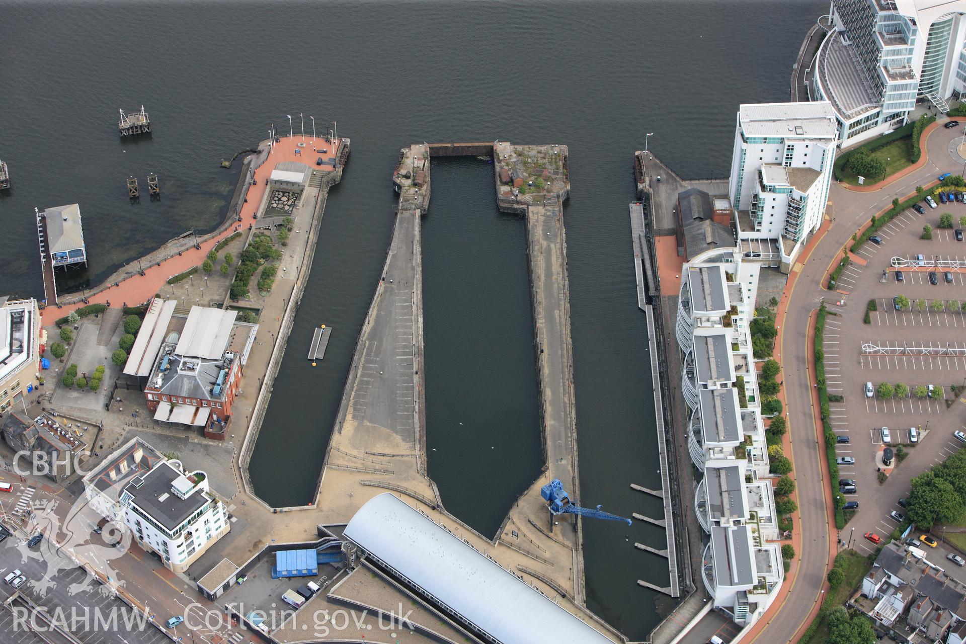RCAHMW colour oblique photograph of Mount Stuart Graving Docks. Taken by Toby Driver on 13/06/2011.
