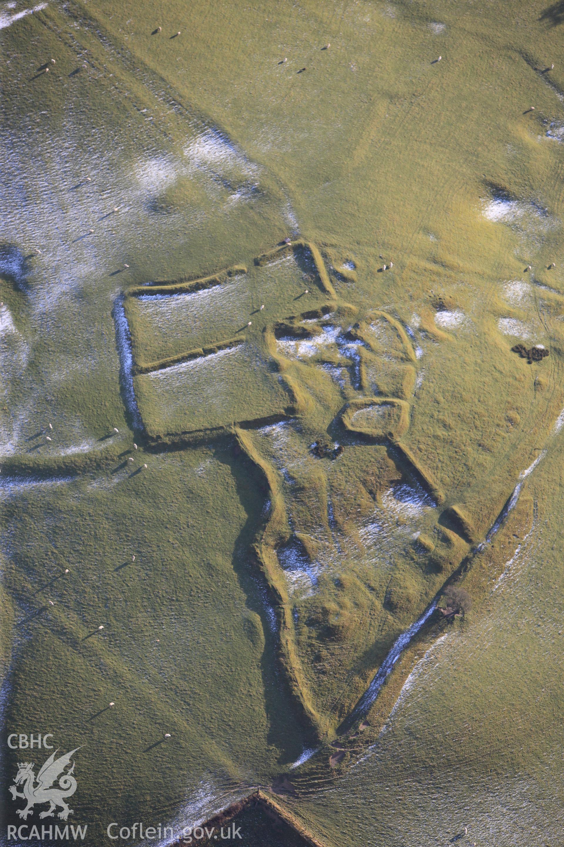 RCAHMW colour oblique photograph of Beili Bedw, settlement complex, under melting snow and low winter light. Reproduced in Driver & Davis (2012) Historic Wales from the Air (RCAHMW), Figure 2, Page 2. Taken by Toby Driver on 18/12/2011.