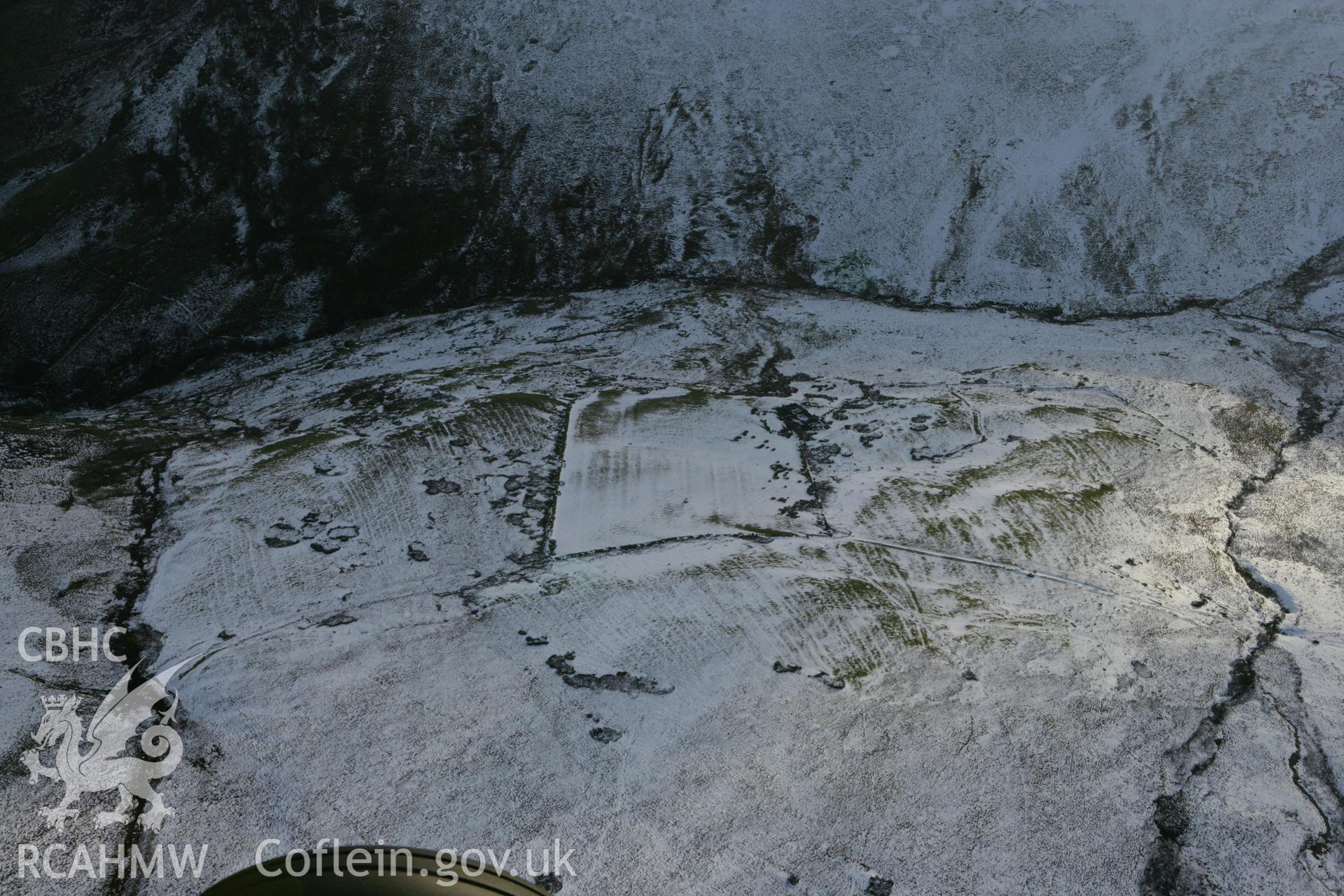 RCAHMW colour oblique photograph of Lluest-Pen-Rhiw, view from north under snow. Taken by Toby Driver on 18/12/2011.