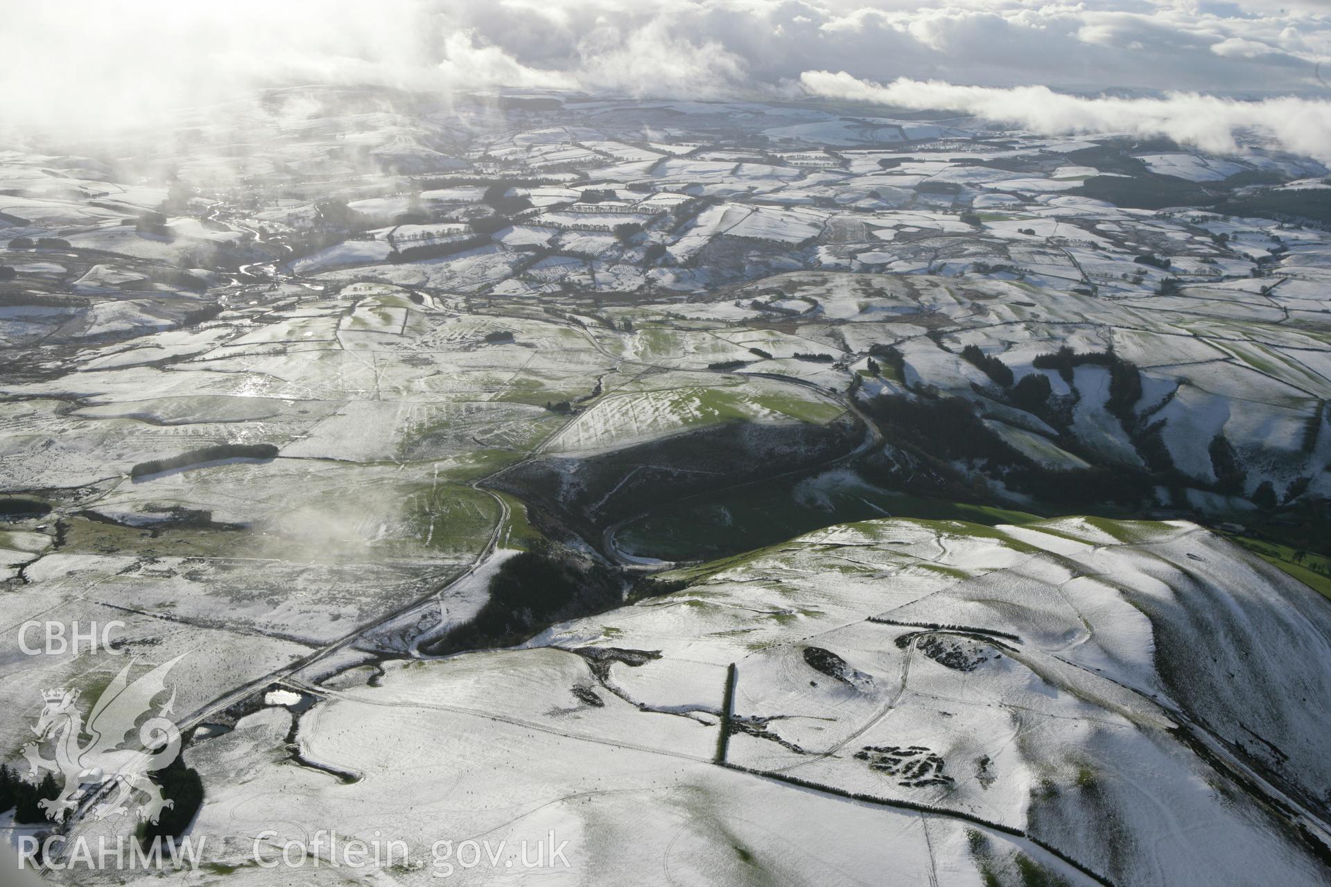 RCAHMW colour oblique photograph of Glog round barrows, high view from north-east. Taken by Toby Driver on 18/12/2011.