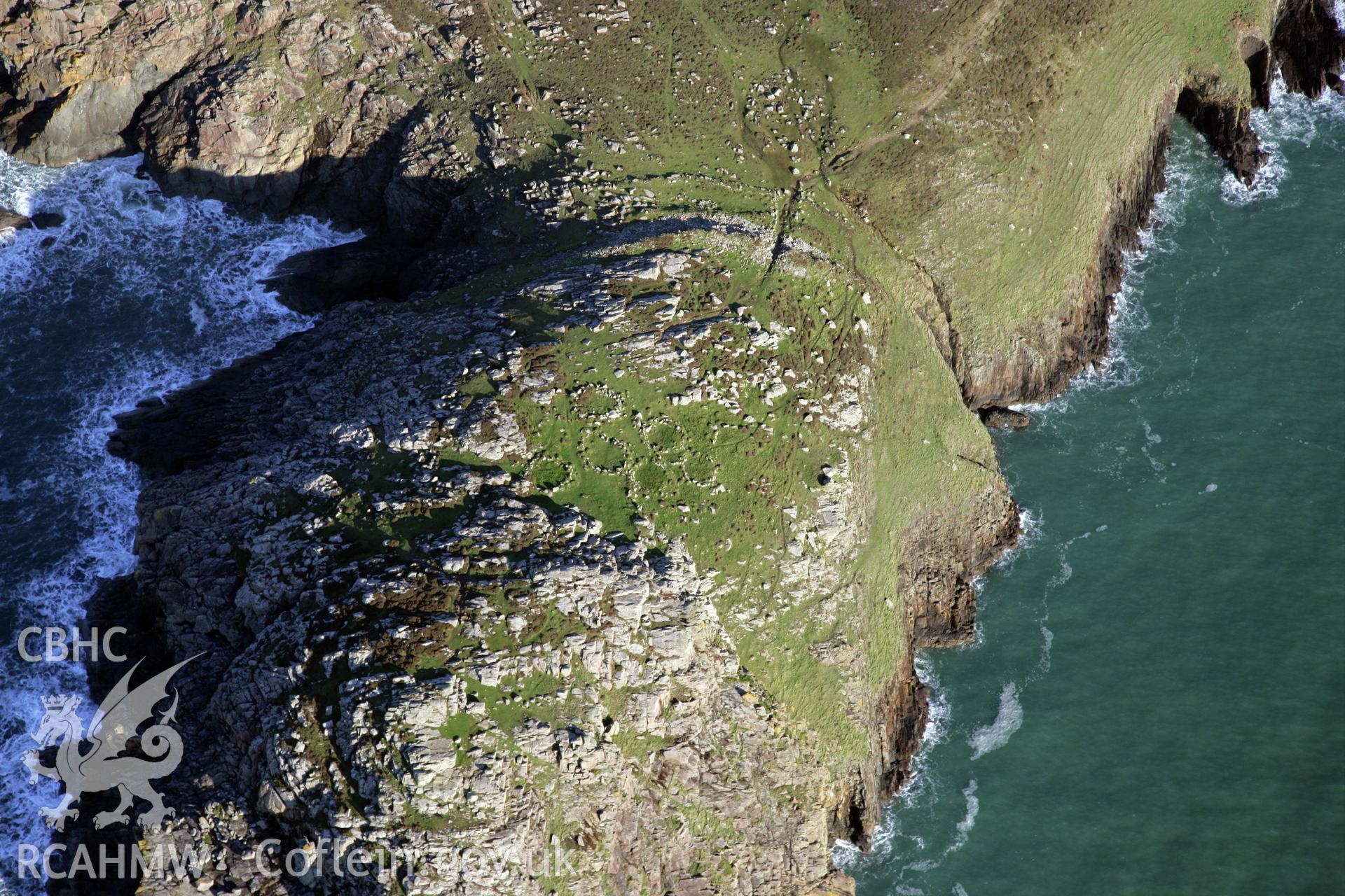 RCAHMW colour oblique photograph of St David's Head Camp, viewed from the south-west. Taken by O. Davies & T. Driver on 22/11/2013.