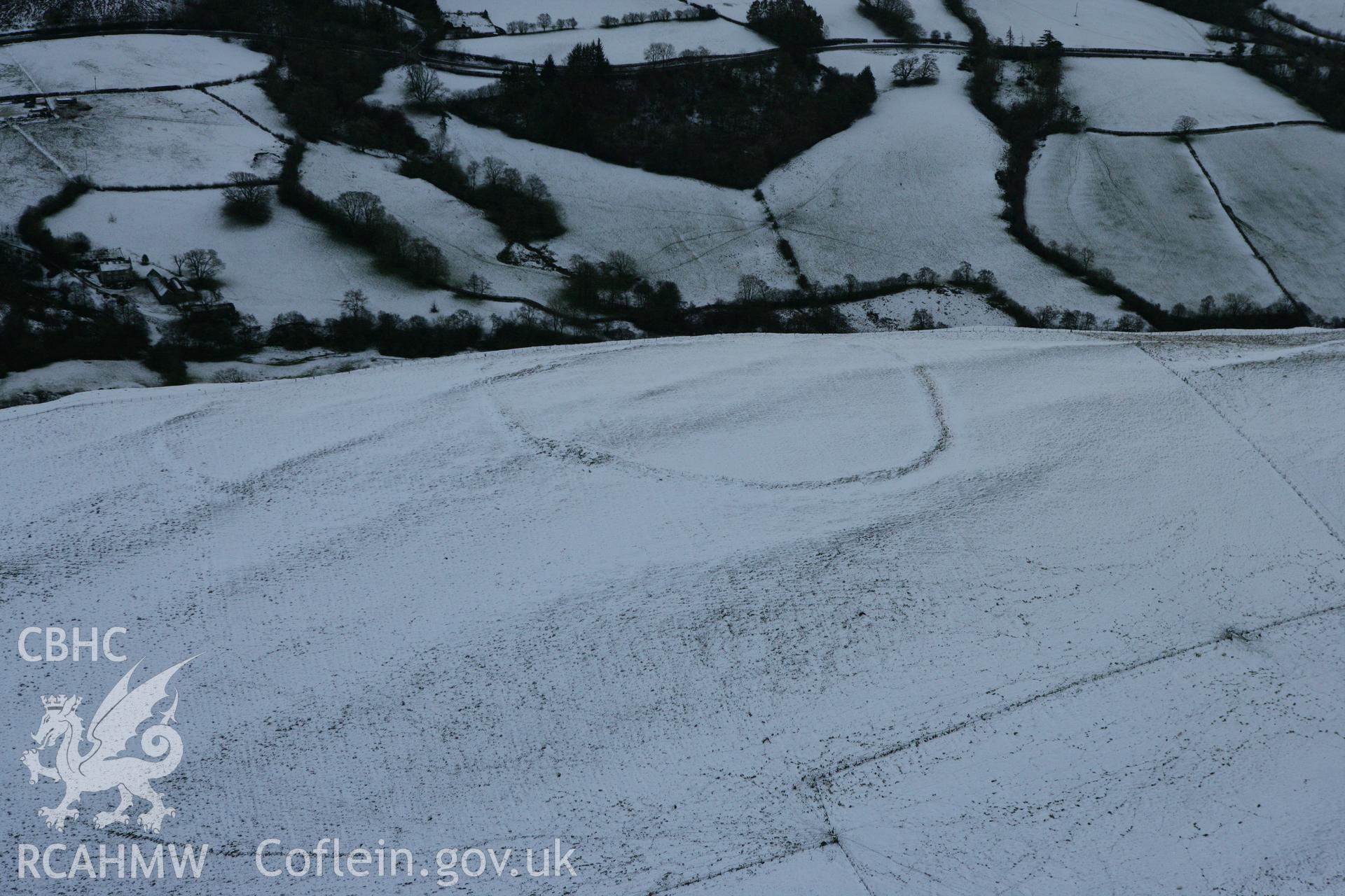 RCAHMW colour oblique photograph of Llyssin hillfort, SAM recommendation. Taken by Toby Driver on 18/12/2011.